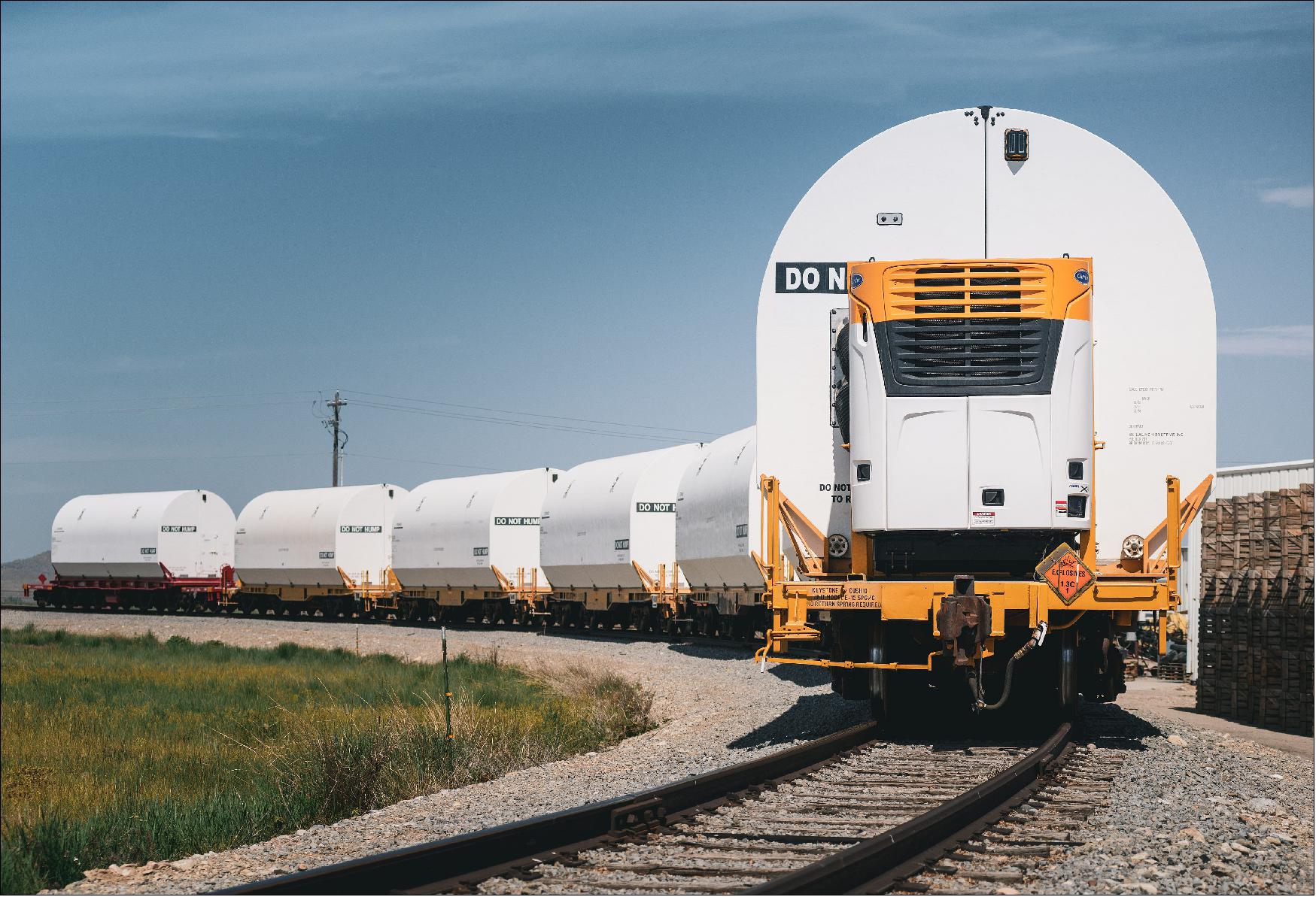 Figure 42: A train carrying the rocket motors for NASA’s Space Launch System rocket after departing a Northrop Grumman manufacturing facility in Utah for NASA’s Kennedy Space Center in Florida on June 5, 2020. The 10 booster segments will power Artemis I, the first mission of NASA’s Artemis program, to the Moon. The 180-ton booster segments are transported in specially outfitted railcars to make the 2,800-mile trip across eight states to Kennedy (image credit: Northrop Grumman)