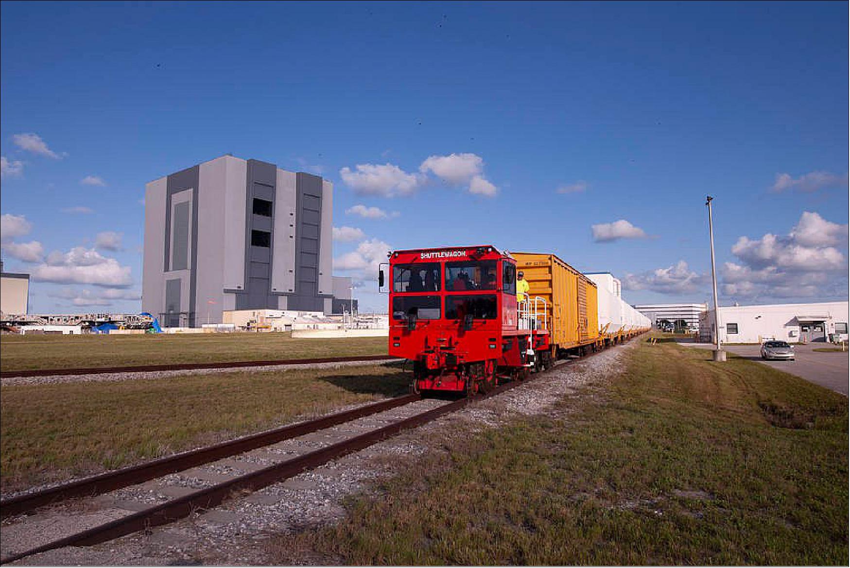 Figure 41: Twin rocket boosters for NASA’s Space Launch System (SLS) that will power Artemis missions to the Moon have arrived at the agency’s Kennedy Space Center in Florida. The two motor segments, each comprised of five segments, arrived at Kennedy’s Rotation, Processing and Surge Facility (RPSF) on June 15, 2020, by train from a Northrop Grumman manufacturing facility in Promontory, Utah. The booster segments will remain in the RPSF for inspection prior to processing until it’s time to move them to the Vehicle Assembly Building for stacking on the mobile launcher. This is the first piece of flight hardware to arrive at Kennedy by train for the Artemis program, but NASA’s Exploration Ground Systems (EGS) can expect to receive additional hardware soon, including the Launch Vehicle Service Adapter and the rocket’s core stage. NASA is working toward an Artemis I launch date in 2021, keeping the program moving at the best possible pace toward the earliest possible opportunity (image credit: NASA/Kevin O'Connell)