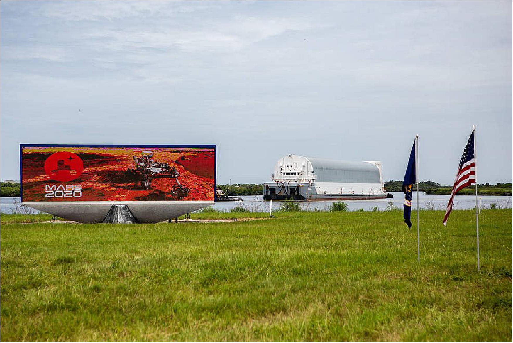 Figure 39: NASA's Pegasus barge, carrying the launch vehicle stage adapter (LVSA) for the agency's Space Launch System (SLS) rocket, arrives at the Kennedy Space Center Launch Complex 39 turn basin wharf on July 29, 2020. Traveling to Florida from NASA's Marshall Space Flight Center in Huntsville, Alabama, the LVSA will connect the SLS core stage to the rocket's upper stage for the Artemis I launch (image credit: NASA/Isaac Watson)