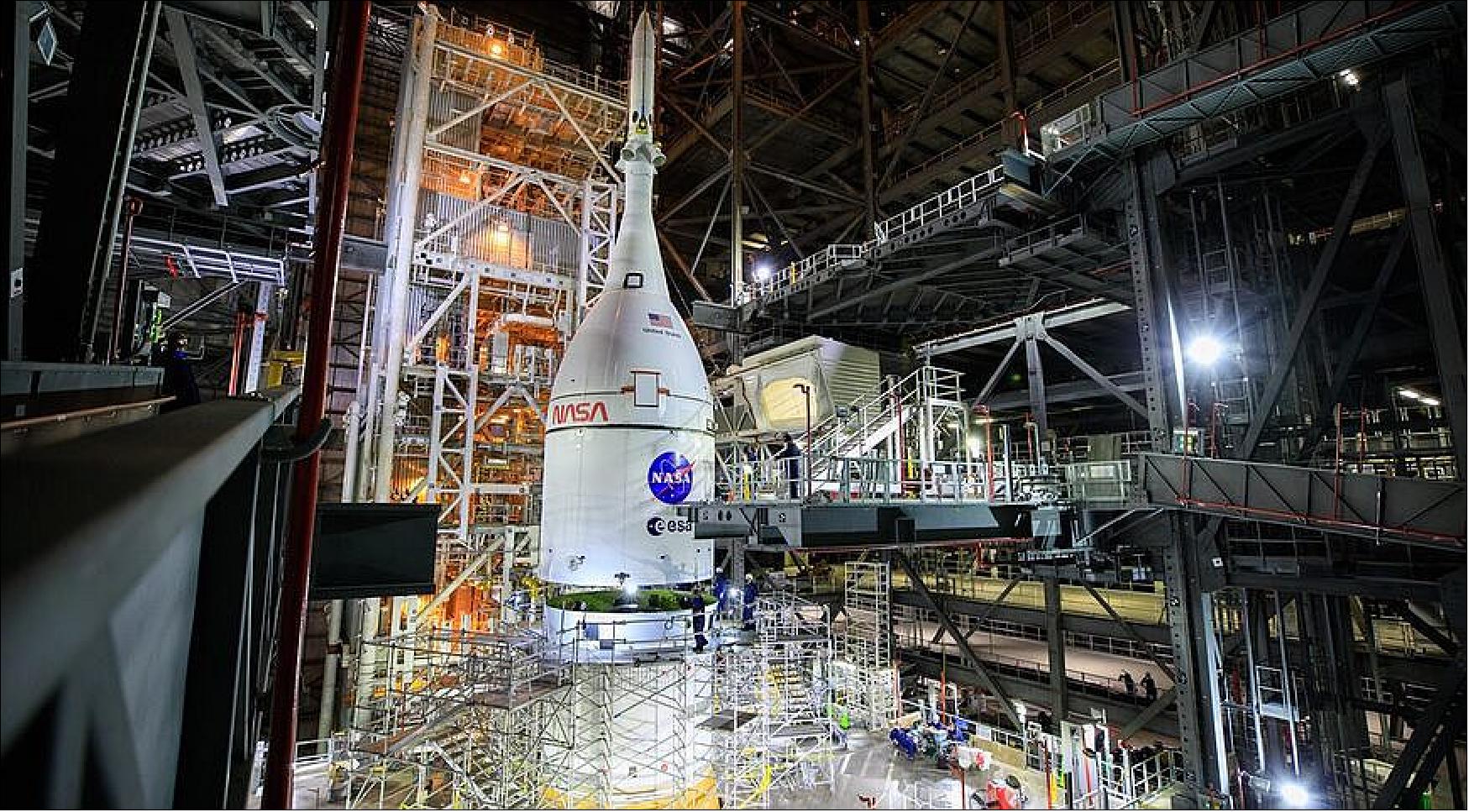 Figure 6: The Orion spacecraft is installed on top of the Space Launch System rocket inside the Vehicle Assembly Building at the Kennedy Space Center Oct. 20, completing the assembly of the vehicle for the Artemis 1 mission now scheduled for no earlier than February 2022 (image credit: NASA, Frank Michaux)