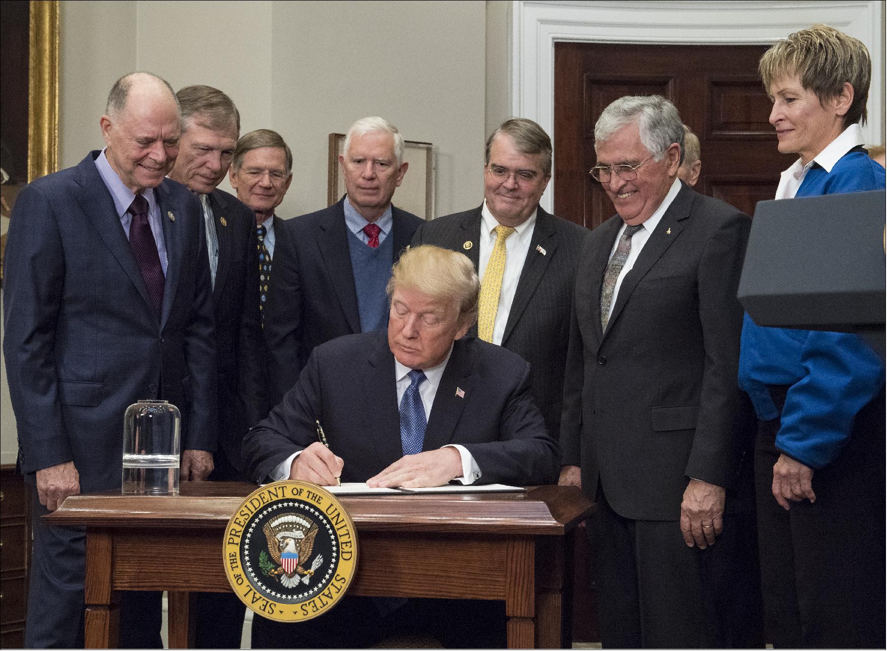 Figure 1: Representatives of Congress and the National Space Council joined President Donald J. Trump, Apollo astronaut Jack Schmitt and current NASA astronaut Peggy Whitson Monday, 11 December 2017, for the president’s signing of Space Policy Directive 1, a change in national space policy that provides for a U.S.-led, integrated program with private sector partners for a human return to the Moon, followed by missions to Mars and beyond (image credit: NASA/Aubrey Gemignani)