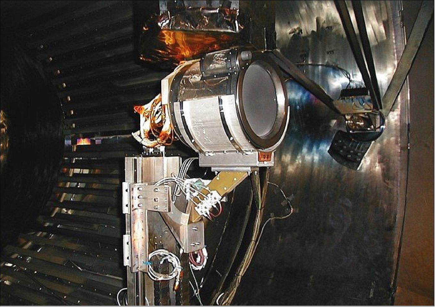 Figure 55: Test setup: The T6 gridded ion thruster being set up for test firing inside the LEEP2 vacuum chamber at QinetiQ in Farnborough. The far end of the vacuum chamber is covered with a protective carbon disc to prevent the sandblasting-like ‘sputtering’ from being in the path of the beam (image credit: ESA)