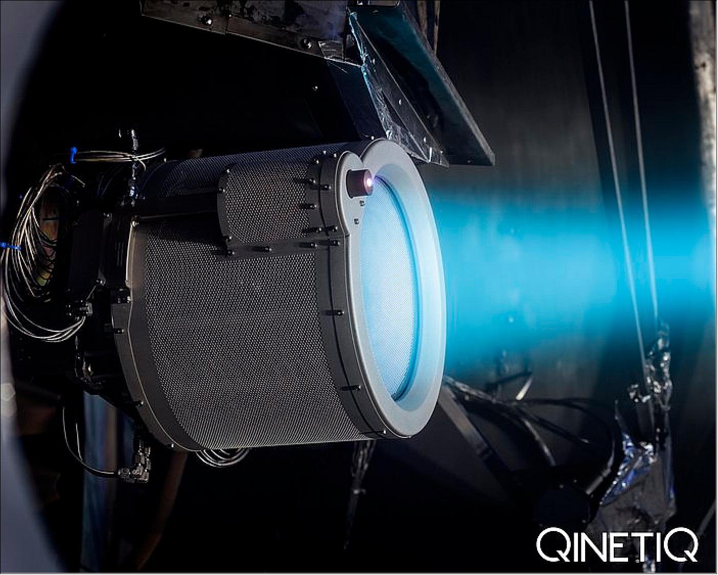 Figure 52: T6 gridded ion thruster being test fired in October 2018 inside the LEEP2 vacuum chamber at QinetiQ in Farnborough, UK. In space the plume seen here would not be visible; it occurs due to vestigial gases building up inside the chamber. The glow from the thruster would be visible however (image credit: QinetiQ)