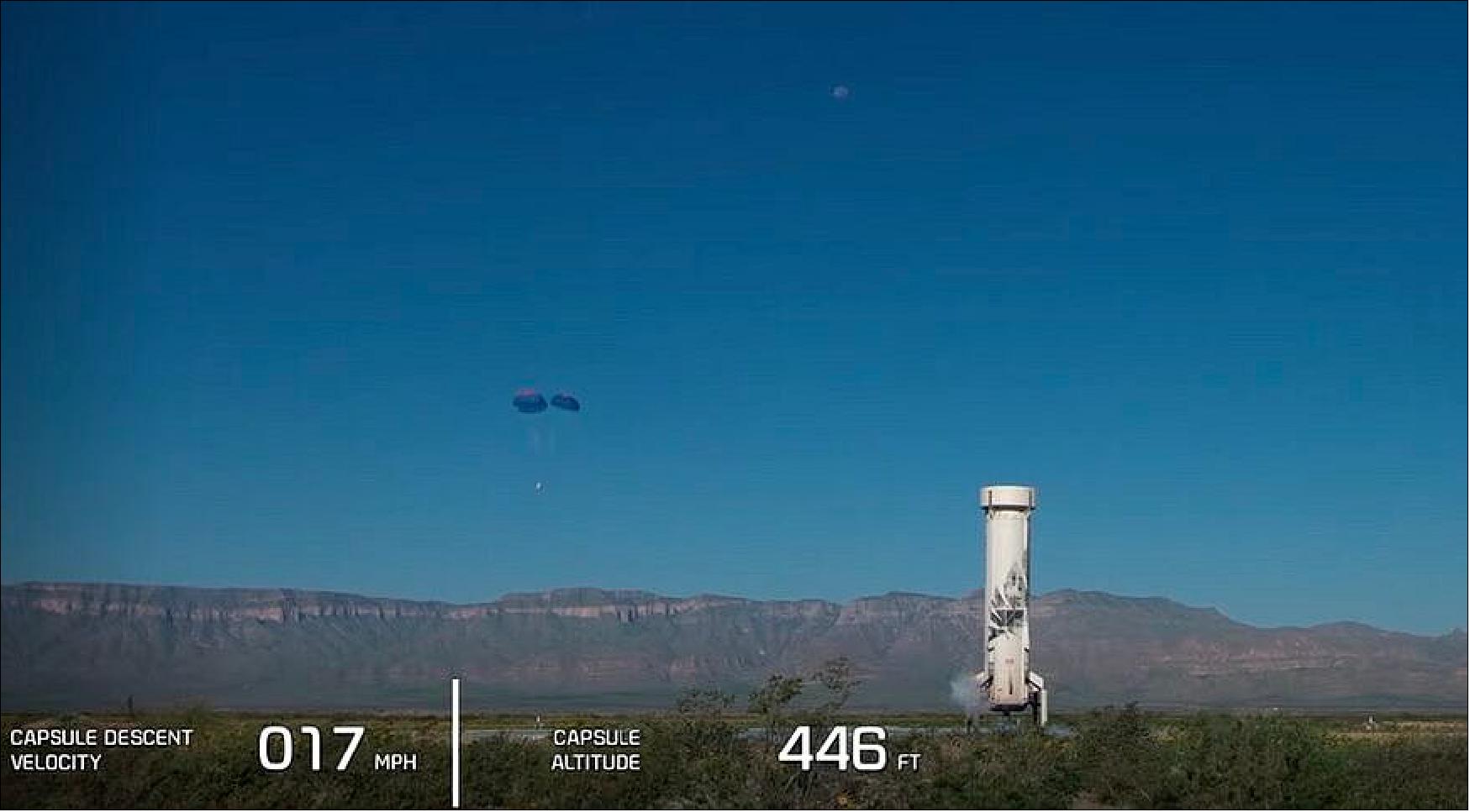 Figure 11: The New Shepard crew capsule descends under parachutes shortly after its booster landed during the NS-17 mission Aug. 25 in West Texas (image credit: Blue Origin webcast)