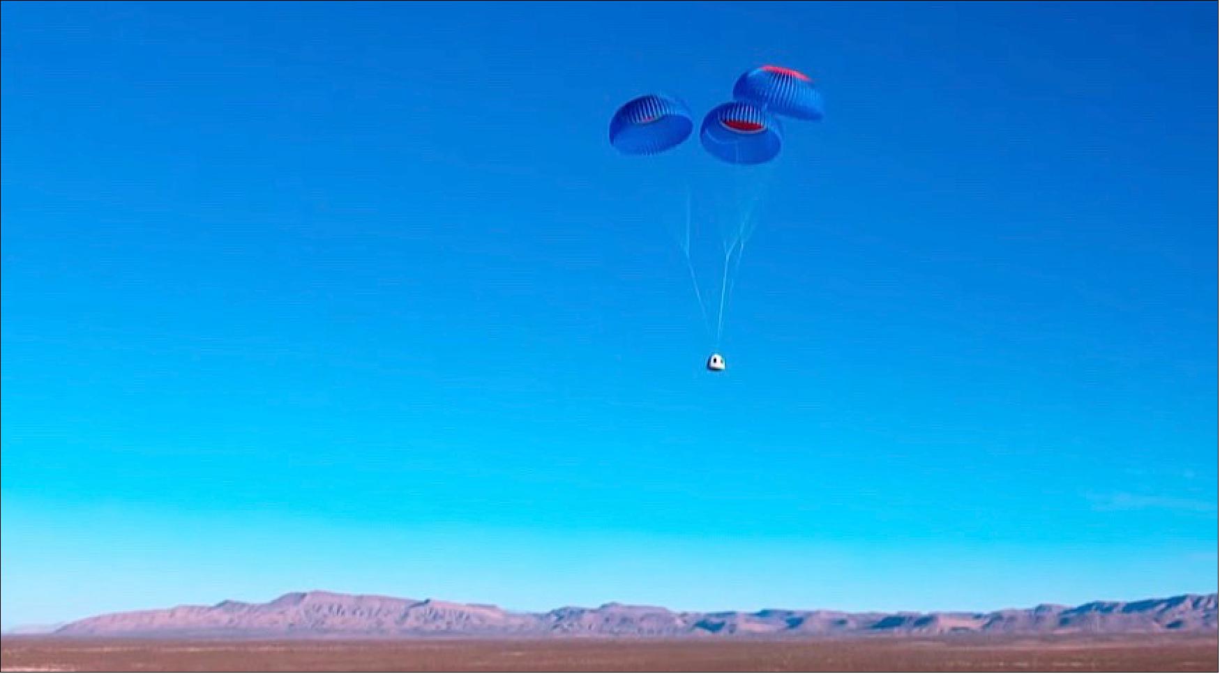 Figure 7: The Blue Origin New Shepard capsule descends under parachutes near the end of the NS-19 flight Dec. 11 (image credit: Blue Origin webcast)