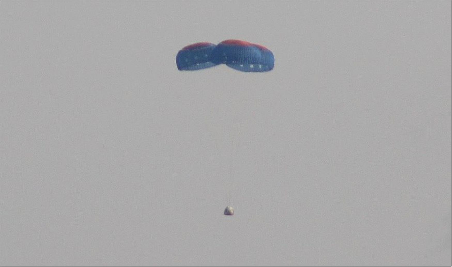 Figure 20: The New Shepard capsule descends under parachutes during its July 20 crewed flight (image credit: SpaceNews/Jeff Foust)