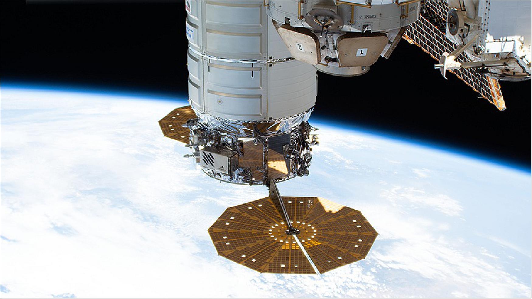 Figure 11: The Cygnus space freighter from Northrop Grumman, with its prominent cymbal-shaped solar arrays, is pictured attached to the space station (image credit: NASA TV)