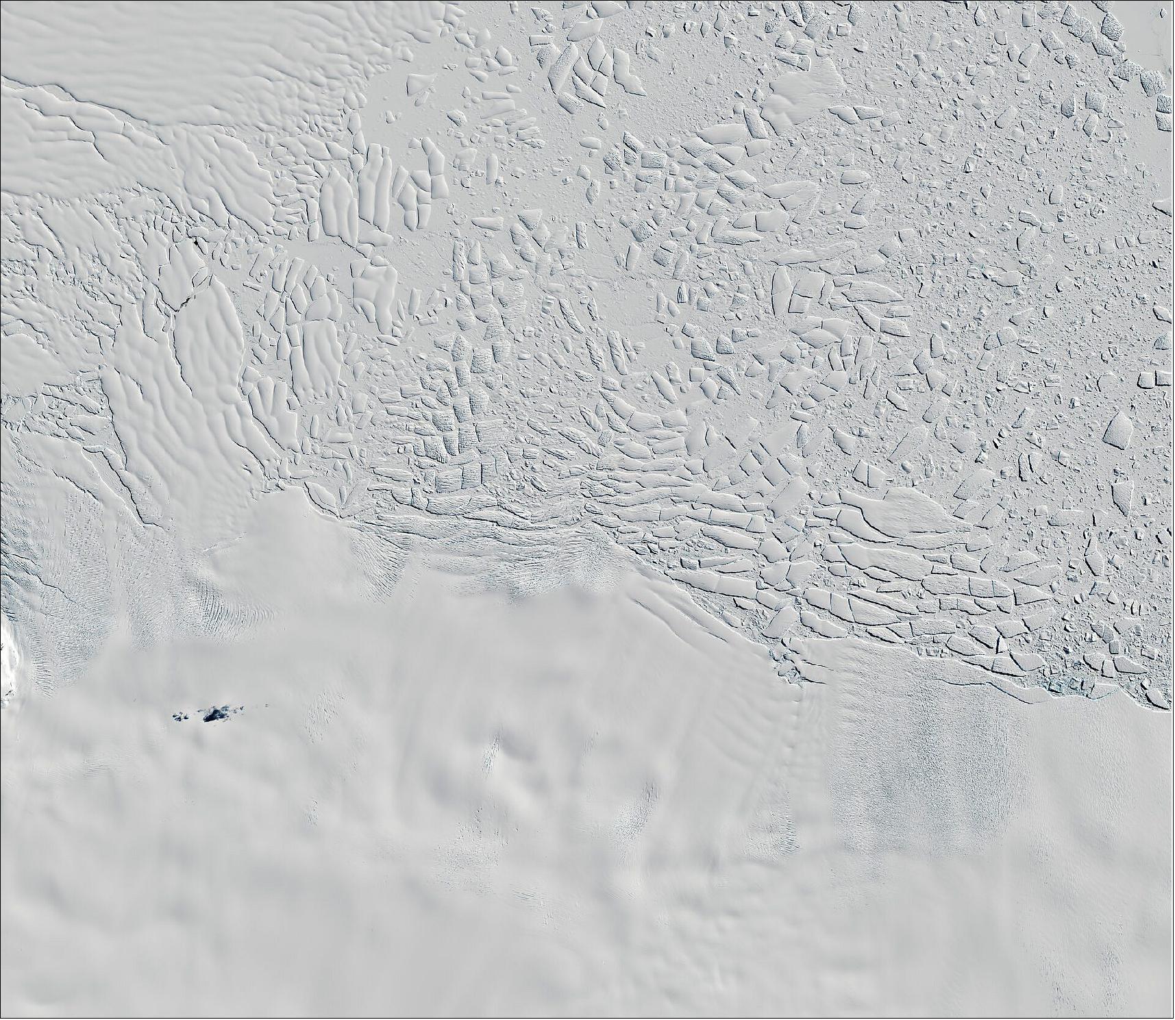 Figure 22: Thwaites glacier seen by Copernicus Sentinel-2. At around 120 km wide, Thwaites is the largest glacier on Earth and one of the most fragile glaciers in Antarctica. Imaged here by Copernicus Sentinel-2 on 26 November 2020, it's hard to imagine what's going on deep below the ice. Hidden from view by ice kilometers thick, there is a vast network of lakes and streams at the base of the Antarctic ice sheet. Using more than 10 years' worth of altimetry data from ESA's CryoSat satellite, scientists discovered that the lakes beneath Thwaites, the largest of which is over 40 km long, drained in quick succession, in 2013 and then in 2017. This kind of drainage under Thwaites has never before been recorded. Scientists estimate that the rate of drainage peaked at about 500 m3 s-1 – possibly the largest outflow of meltwater ever reported from subglacial lakes in this region (image credit: ESA, the image contains modified Copernicus Sentinel data (2020), processed by ESA, CC BY-SA 3.0 IGO)
