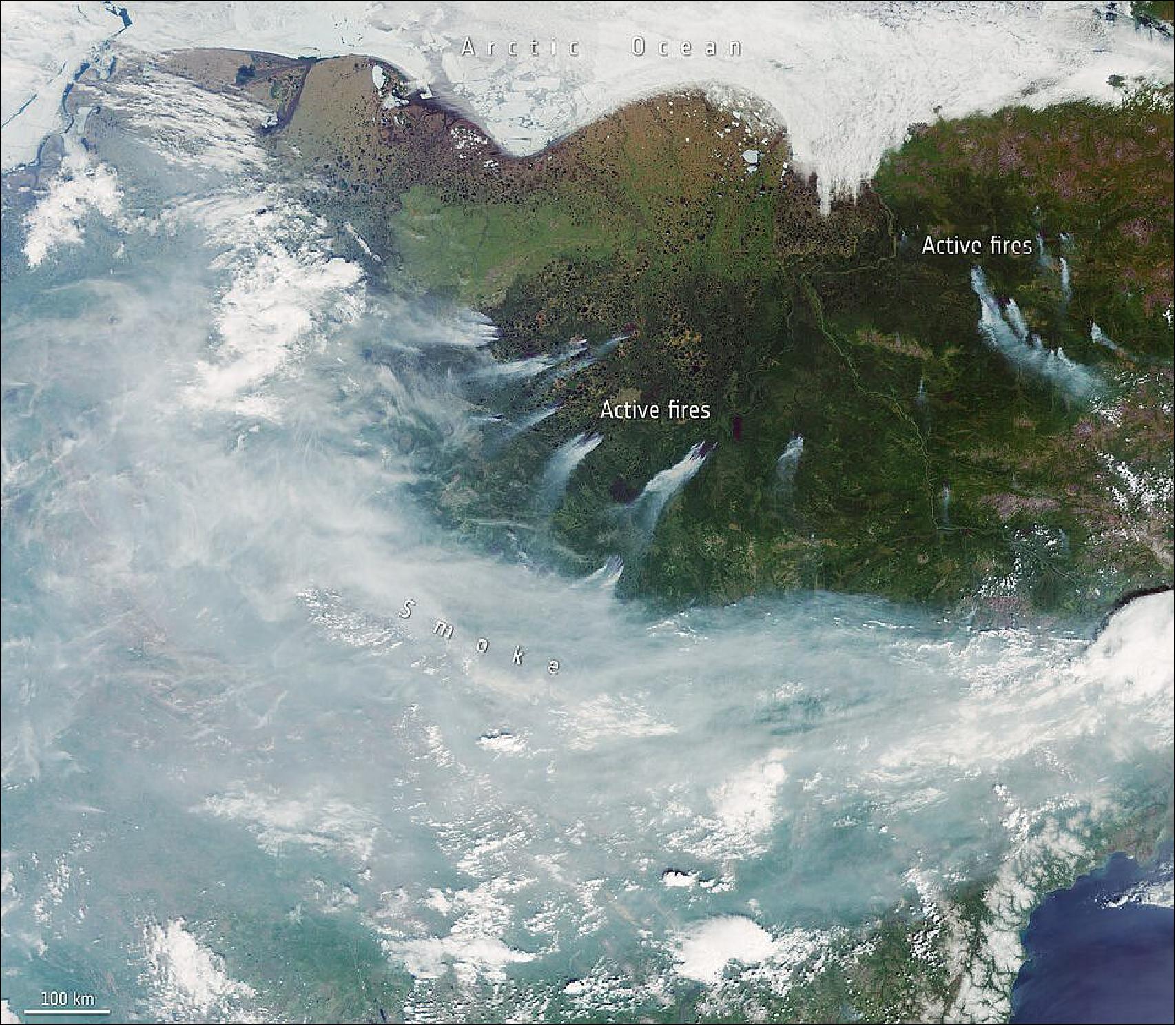 Figure 50: This image of Siberian fires was captured on 23 June 2020 by the OLCI instrument on board the Copernicus Sentinel-3 mission. Part of Sakha, Chukotka and the Magadan Oblast is pictured here. Sea-ice can be seen to the north while smoke dominates the bottom part of the image with a number of active fires visible in the center (image credit: ESA, the image contains modified Copernicus Sentinel data (2020), processed by ESA, CC BY-SA 3.0 IGO)