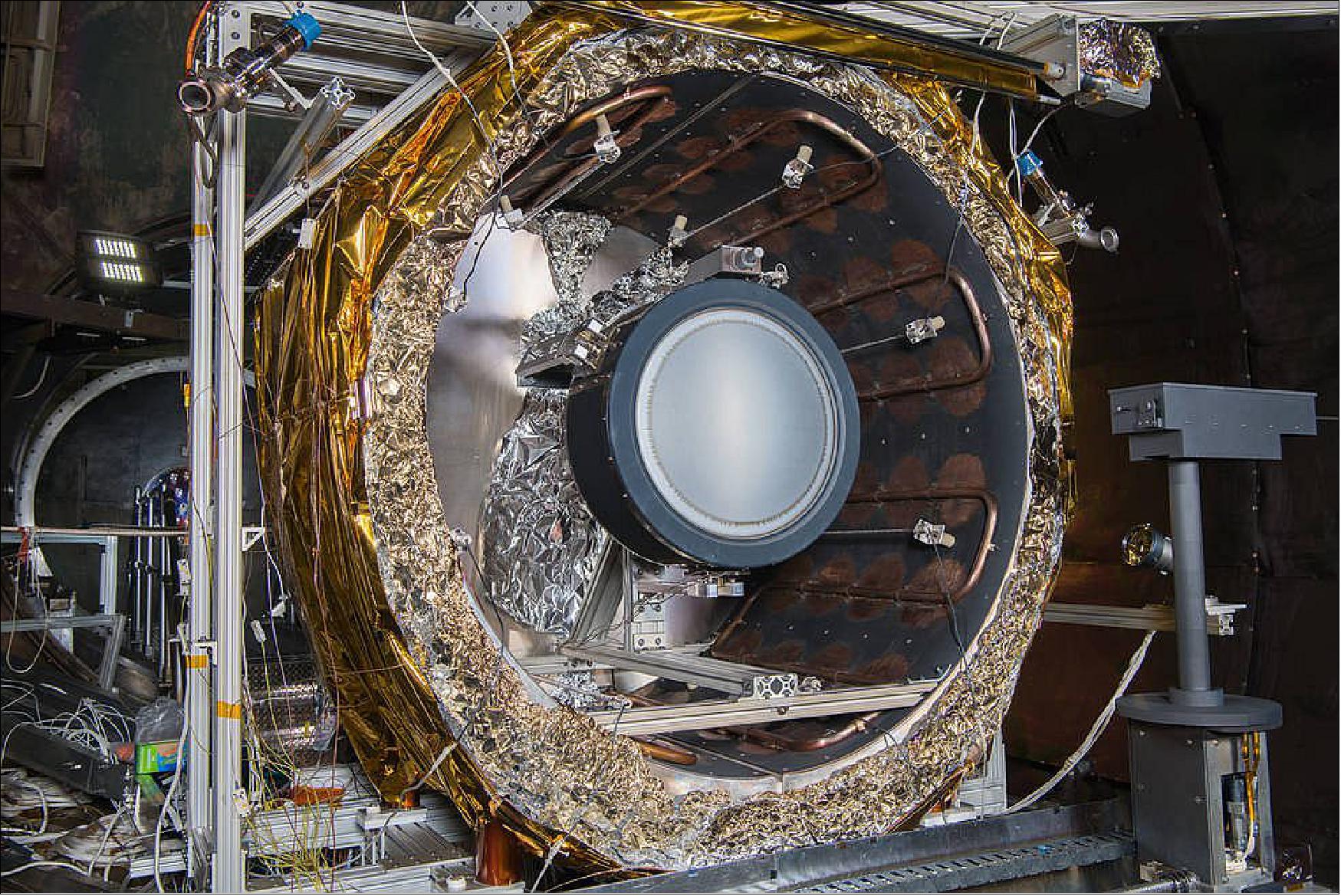 Figure 16: The NEXT-C flight thruster is mounted within a thermal shroud in one of NASA Glenn’s vacuum chambers. The thermal shroud subjects the thruster to the extreme thermal environments it has been designed to withstand (image credit: NASA, Bridget Caswell)