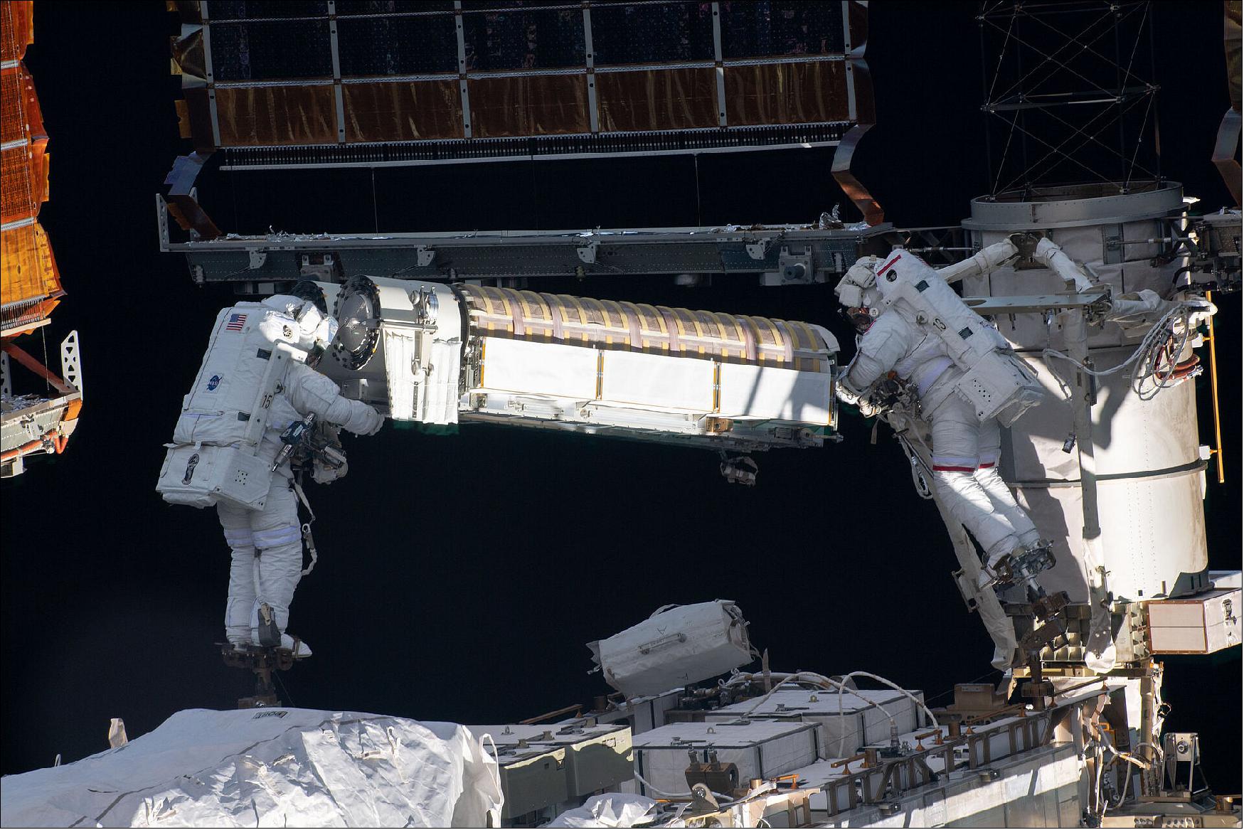 Figure 4: ESA astronaut Thomas Pesquet and NASA astronaut Shane Kimbrough performed three spacewalks in the span of 10 days to install two new solar arrays that will generate more electricity on the International Space Station. On the first spacewalk on 16 June 2021, Shane and Thomas collected the solar arrays, released them from their carrier and moved them to the installation site on the port side of the Station (image credit: ESA/NASA)