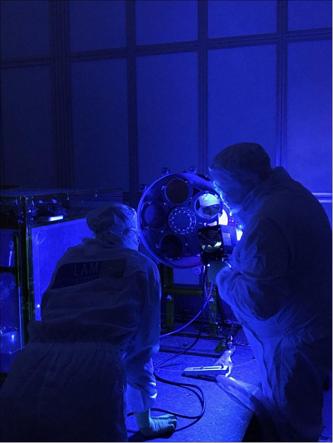 Figure 34: Technicians inspect the filter wheel of ESA’s Euclid mission’s NISP instrument. This component of NISP allows operators to select which wavelengths of infrared light are to be observed by the instrument (image credit: Euclid Consortium & NISP instrument team)