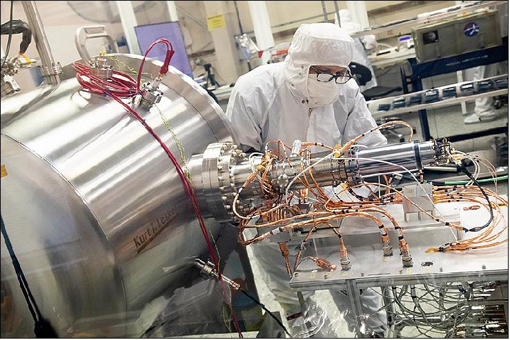 Figure 26: SwRI's (Southwest Research Institute) Dan Aaron (lead spectrometer technician) is making final adjustments to the electrical connections between the MAss SPectrometer for Planetary EXploration/Europa (MASPEX) EBox and the spectrometer prior to flight model calibration (image credit: NASA/SwRI)