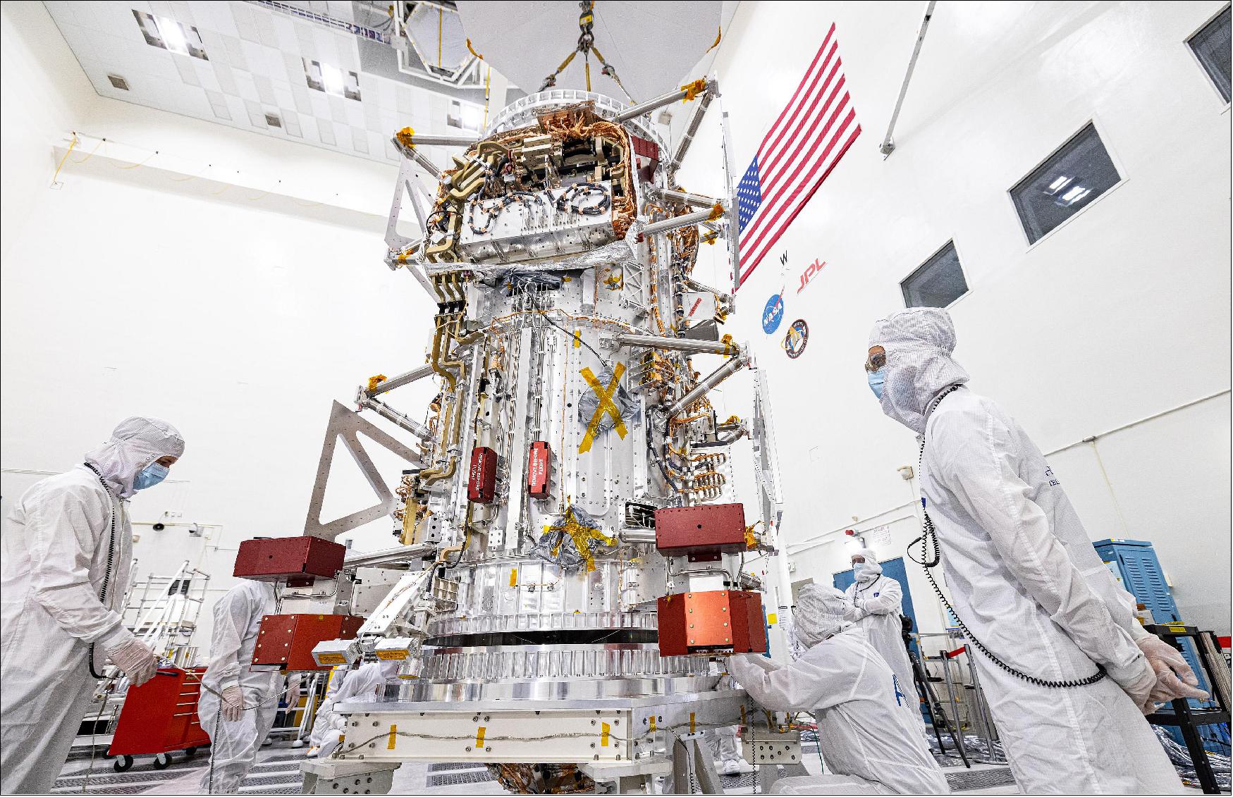 Figure 6: NASA's Europa Clipper spacecraft is visible in a main clean room at JPL, as engineers and technicians inspect it just after delivery in early June 2022 (image credit: NASA/JPL-Caltech/Johns Hopkins APL/Ed Whitman)