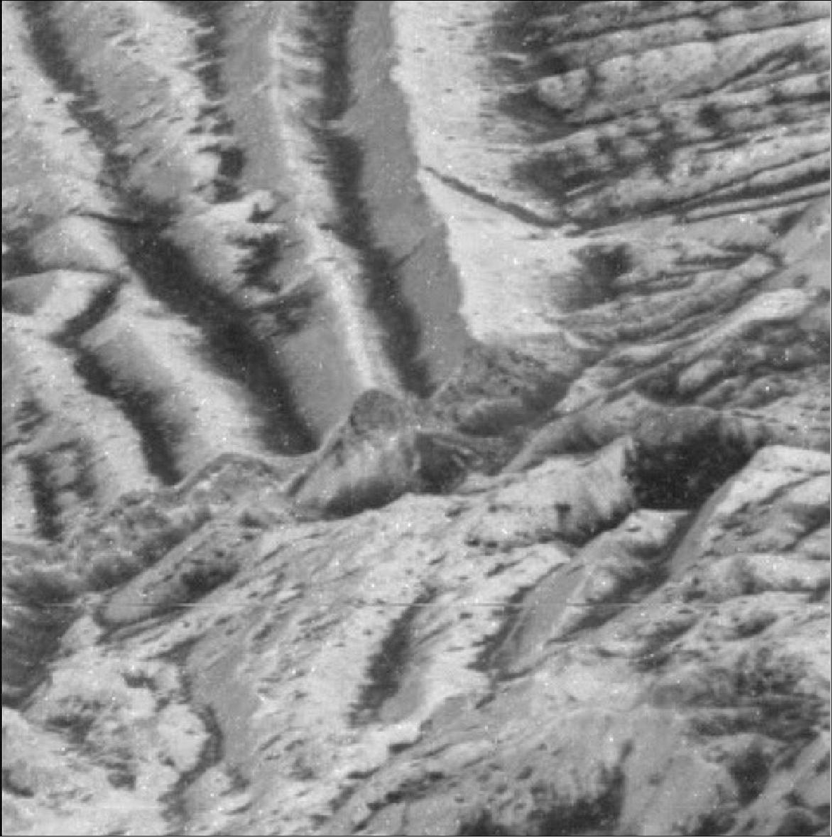 Figure 17: In this zoomed-in image of Europa's surface, captured by NASA's Galileo mission, the thin, bright layer, visible atop a cliff in the center shows the kind of areas churned by impact gardening (image credit: NASA/JPL-Caltech)