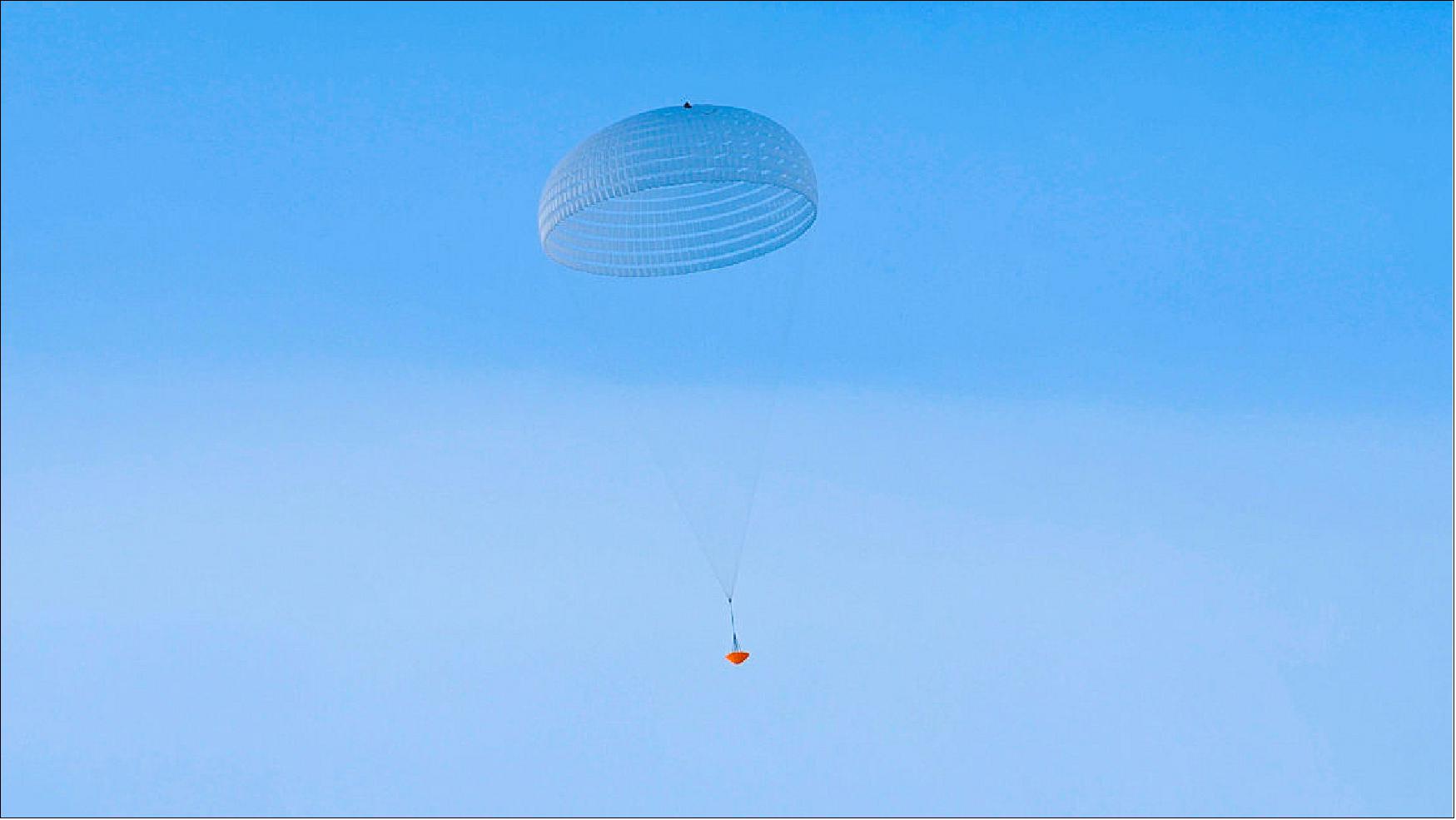 Figure 93: The deployment of the large 35 m-wide parachute of the upcoming ExoMars 2020 mission was tested in a low-altitude drop test earlier this month. The image captures the inflated ring-slot parachute with the drop test vehicle suspended underneath (image credit: ESA/I.Barel)