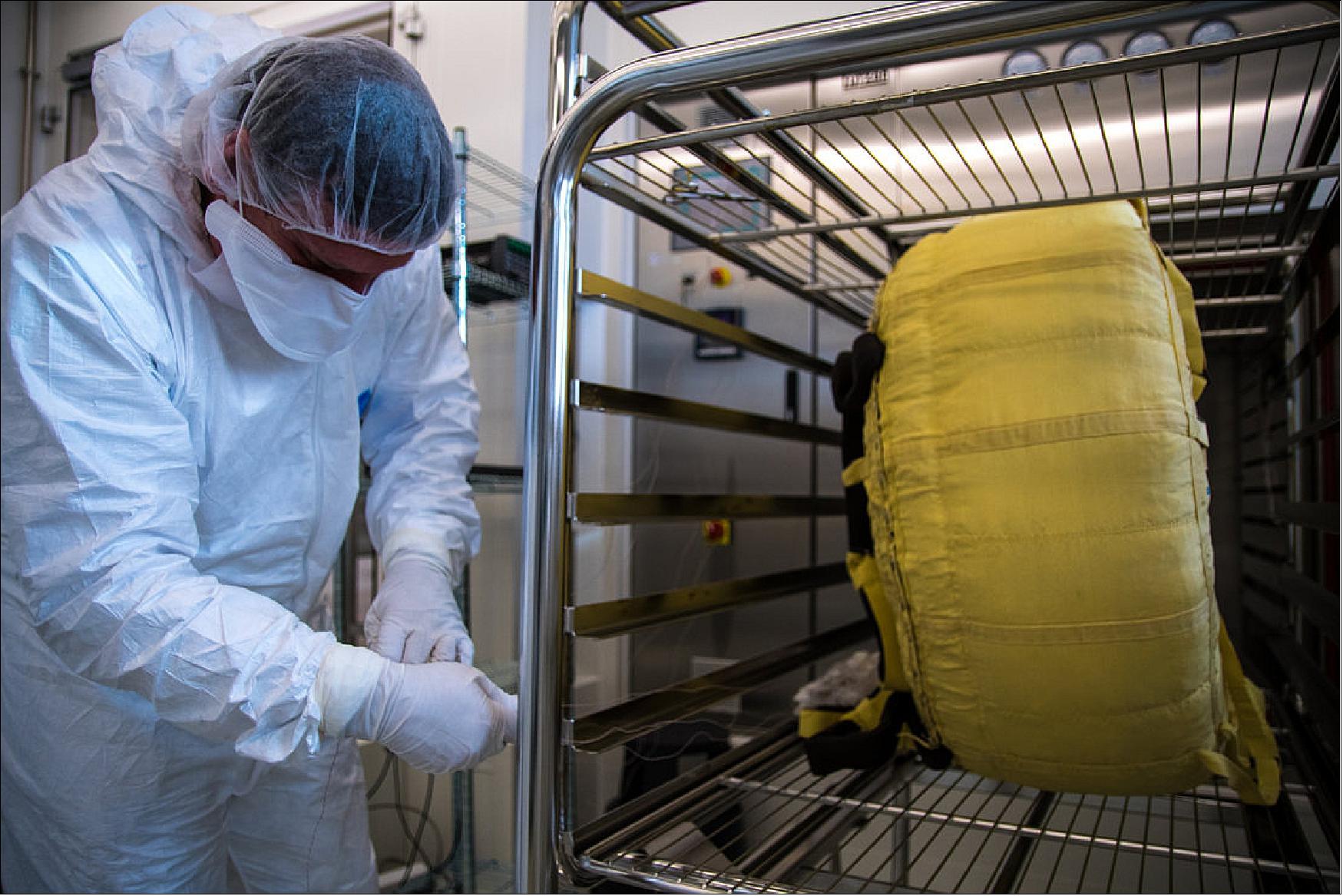 Figure 74: A technician places a nearly 70 kg parachute designed for ESA and Roscosmos’s ExoMars 2020 mission inside the dry heater sterilizer of the Agency’s Life, Physical Sciences and Life Support Laboratory, based in its Netherlands technical center (image credit: ESA, M. Cowan)