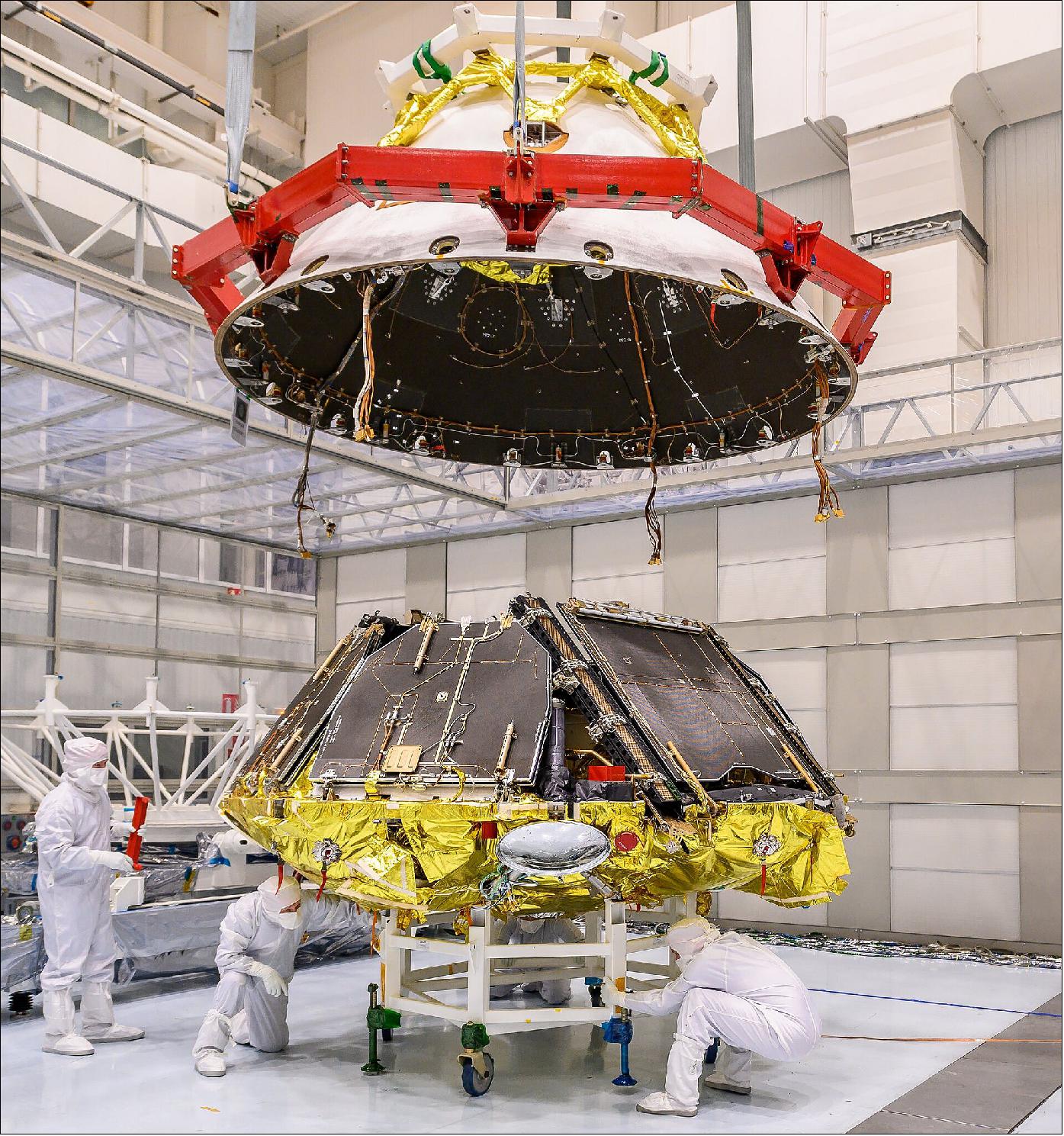 Figure 40: The Kazachok landing platform of the ExoMars mission is revealed as the descent module rear jacket is lifted above. The platforms ramps and solar panels are seen in folded configuration. Kazachok currently sits on a supporting trolley where eventually the front shield will be fitted. The platform and Rosalind Franklin rover will undergo joint testing at the Thales Alenia Space facility in Cannes, France, in the coming weeks (image credit: Thales Alenia Space)