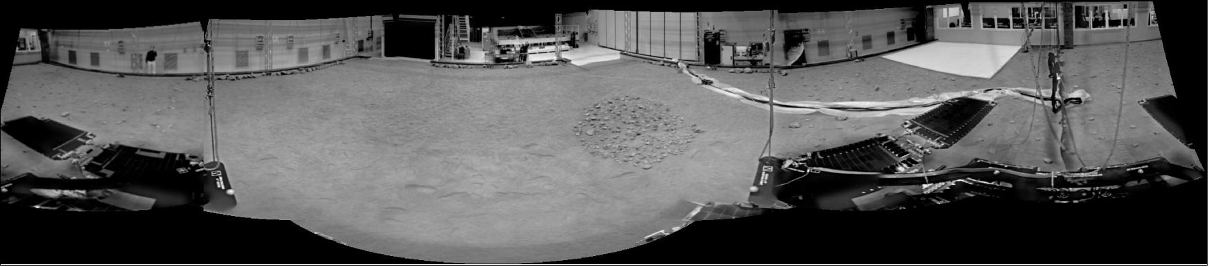 Figure 30: The replica ExoMars rover – the GTM (Ground Test Model) – that will be used in the Rover Operations Control Centre to support mission training and operations has completed its first drive around the Mars Terrain Simulator. As part of the exercise, the GTM’s black-and-white navigation cameras (NavCam) took a series of images to create this panoramic view (image credit: ESA/ExoMars/NavCam)