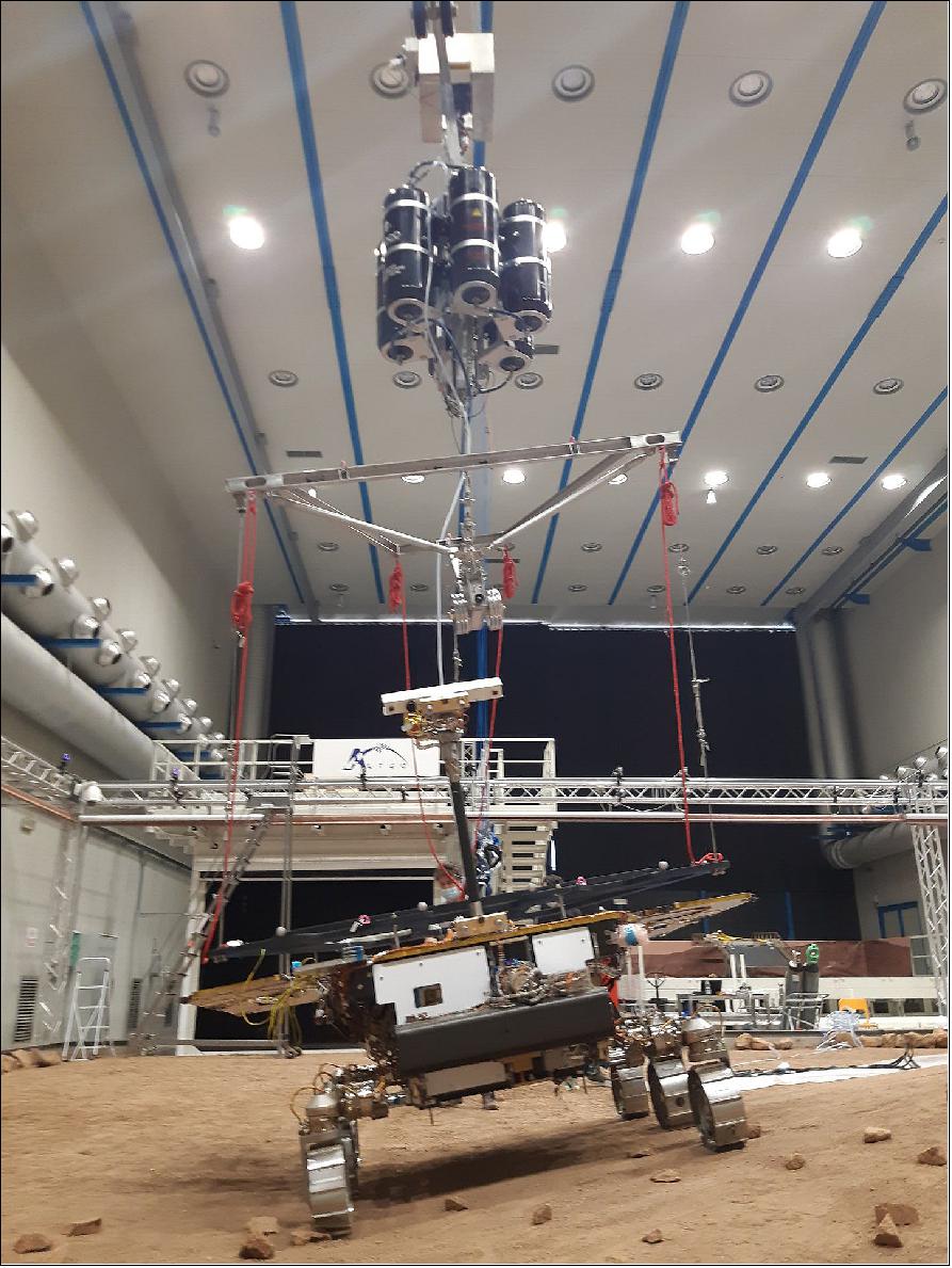 Figure 29: This image shows the rover tackling a side slope in the Mars Terrain Simulator. The ‘Rover Unloading Device’ attached to the GTM from the ceiling is clearly visible – this acts to support the weight of the rover to help recreate martian gravity, which is one-third that of Earth’s (image credit: Thales Alenia Space)