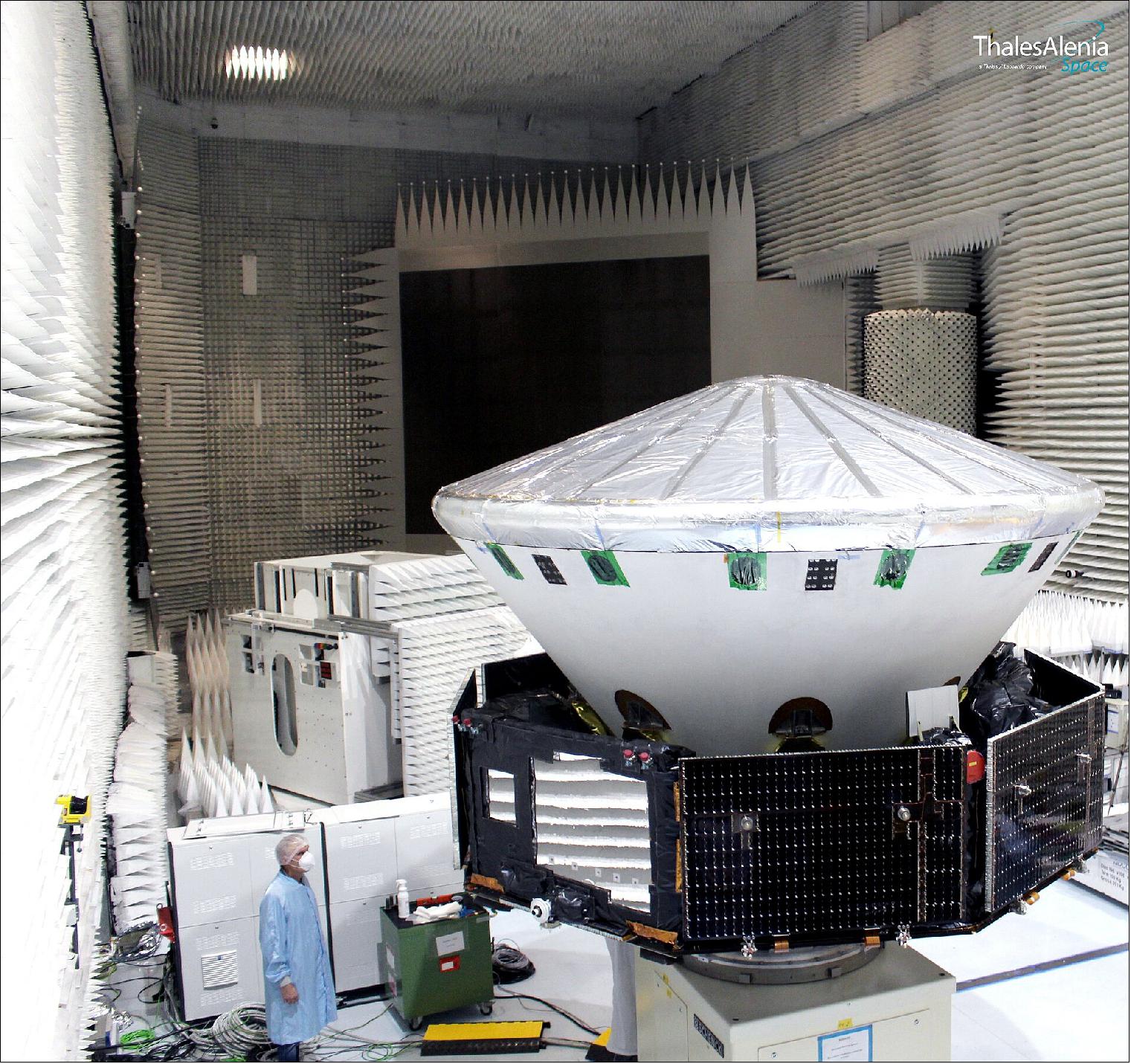 Figure 15: This image shows the complete spacecraft composite of the ExoMars 2022 mission in an anechoic chamber at Thales Alenia Space’s facilities in Cannes, France. The spacecraft comprises the carrier module (the eight sided structure), the descent module (the white module in the centre) and the Rosalind Franklin rover and Kazachok surface platform, which are encapsulated inside the descent module. The person to the left of the image gives a sense of scale. This image was captured during a dynamic balancing test of the actual flight modules that will fly to Mars – an activity to ensure the spacecraft is perfectly balanced when spinning in space (image credit: Thales Alenia Space)