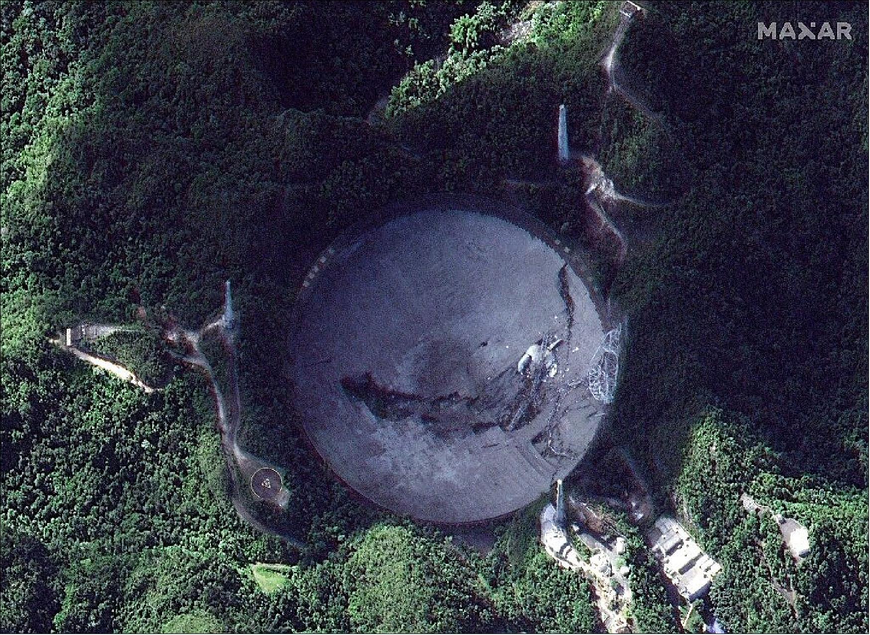 Figure 17: This satellite image shows the Arecibo Observatory in Arecibo, Puerto Rico, after the collapse of its 900-ton receiver platform (image credit: Maxar)