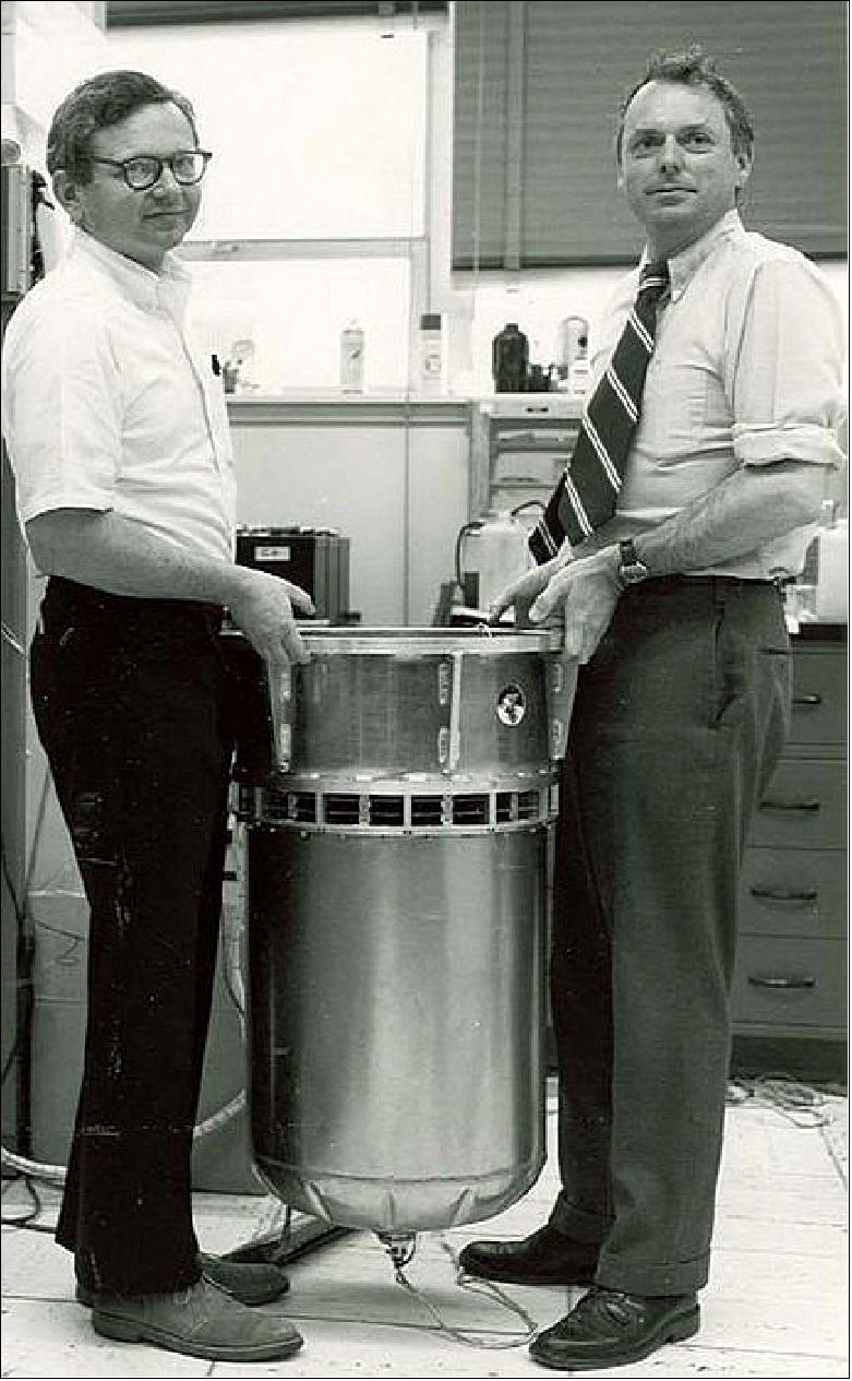 Figure 66: The Gravity Probe A payload of 1976, flown in a highly elliptic single orbit to measure the ‘gravitational redshift' of Einstein's Theory of General Relativity more accurately than ever before, seen with its designers Robert Vessot and Martin Levine of the Smithsonian Astrophysical Observatory. The experiment compared a hydrogen maser clock on Earth with its replica in space as it ascended to about 10,000 km, and confirmed theoretical expectations to an accuracy of 0.02% (https://einstein.stanford.edu)