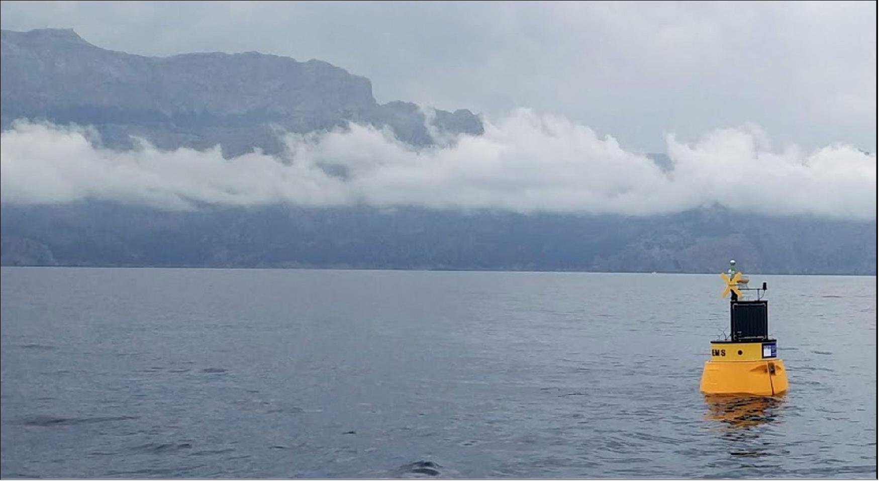 Figure 31: This localization buoy was placed in the sea off Mallorca to help validate results from the GNSS reflectometry test campaign. The satnav receivers can be seen atop the Mallorca skyline (image credit: Institute for Space Studies of Catalonia)