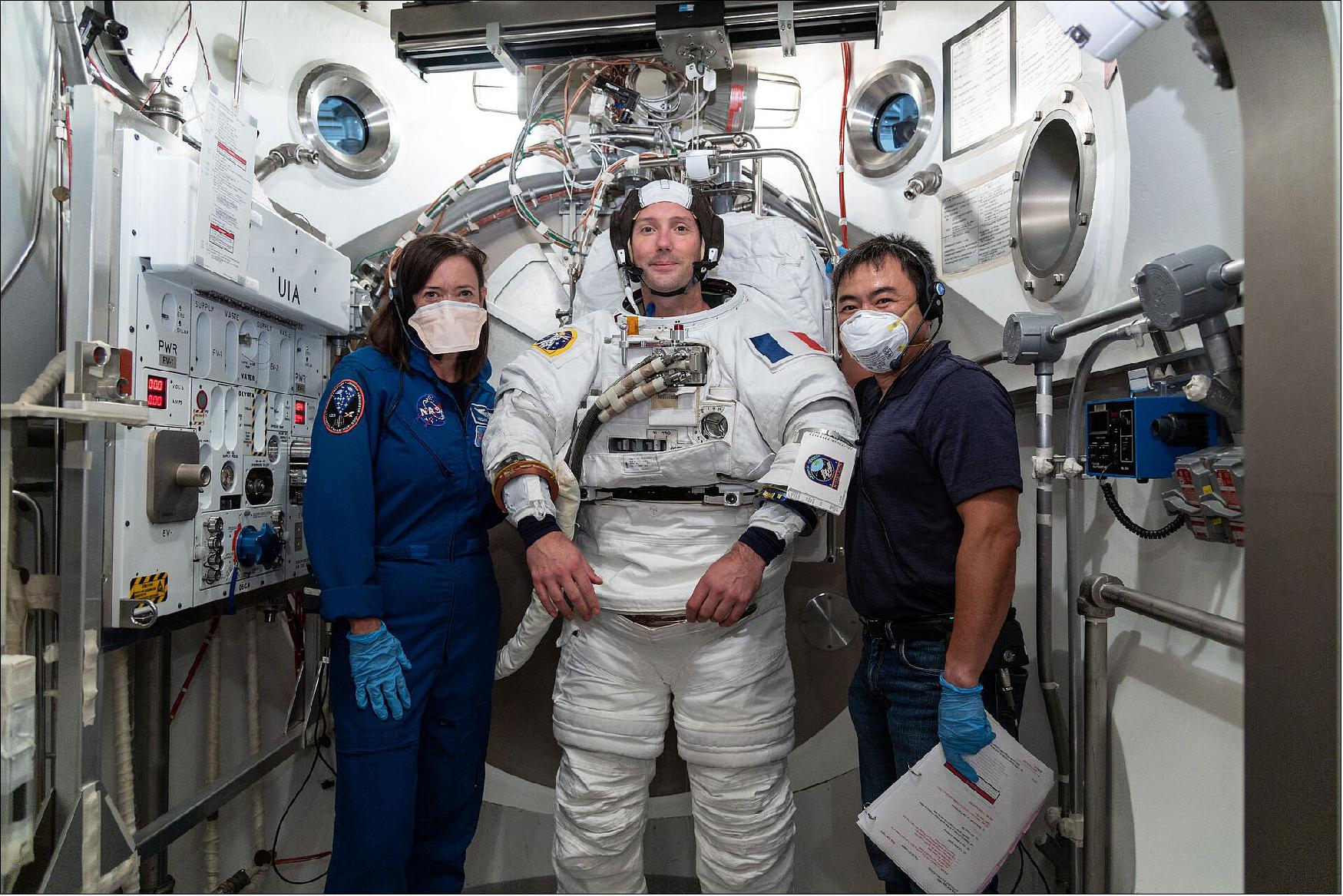 Figure 10: Thomas Pesquet vacuum chamber training. ESA astronaut Thomas Pesquet during a test of the US spacesuit used for spacewalks at NASA's Johnson Space Center, 22 September 2020. To his right is NASA astronaut Megan Behnken and to his left is Japanese astronaut Aki Hoshide who will be launched alongside Thomas and NASA astronaut Shane Kimbrough to the International Space Station in a SpaceX Crew Dragon capsule (image credit: NASA, R. Markowitz)