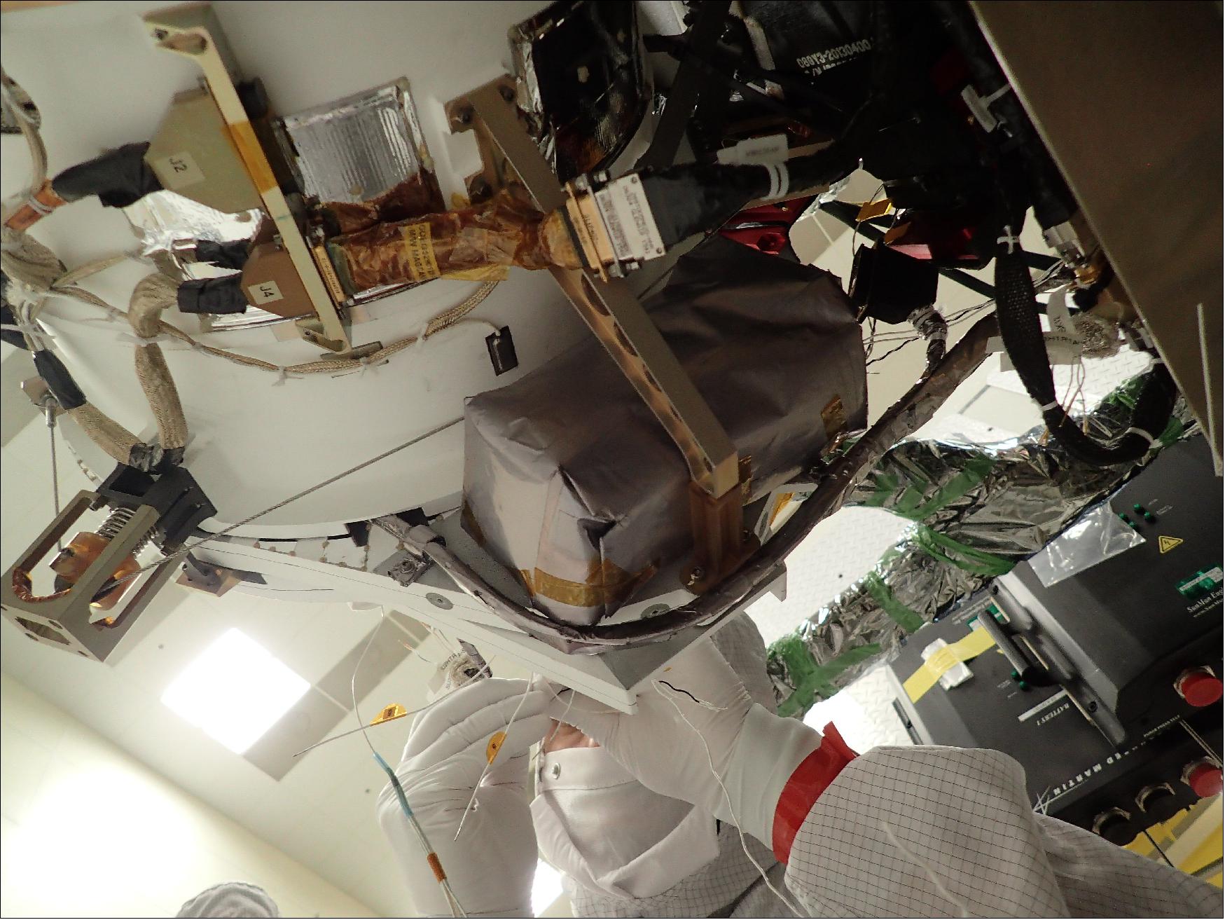 Figure 10: A technician works to install GMAG on the GOES-T spacecraft (image credit: Lockheed Martin)