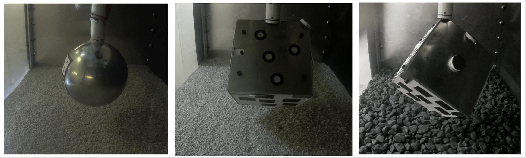 Figure 39: Lander models inside drop box. Different test models landing on the simulated asteroid terrain inside the ISAE-Supaero drop tower's test box, to investigate landing behavior in low-gravity conditions. An existing drop tower, previously designated for aircraft and material drop-tests was customized with a system of pulleys and counterweights to simulate reduced-gravity. The test models began as spherical in shape, progressing to CubeSat-shaped test models, and are embedded with accelerometers (image credit: ISAE-Supaero–N. Murdoch)