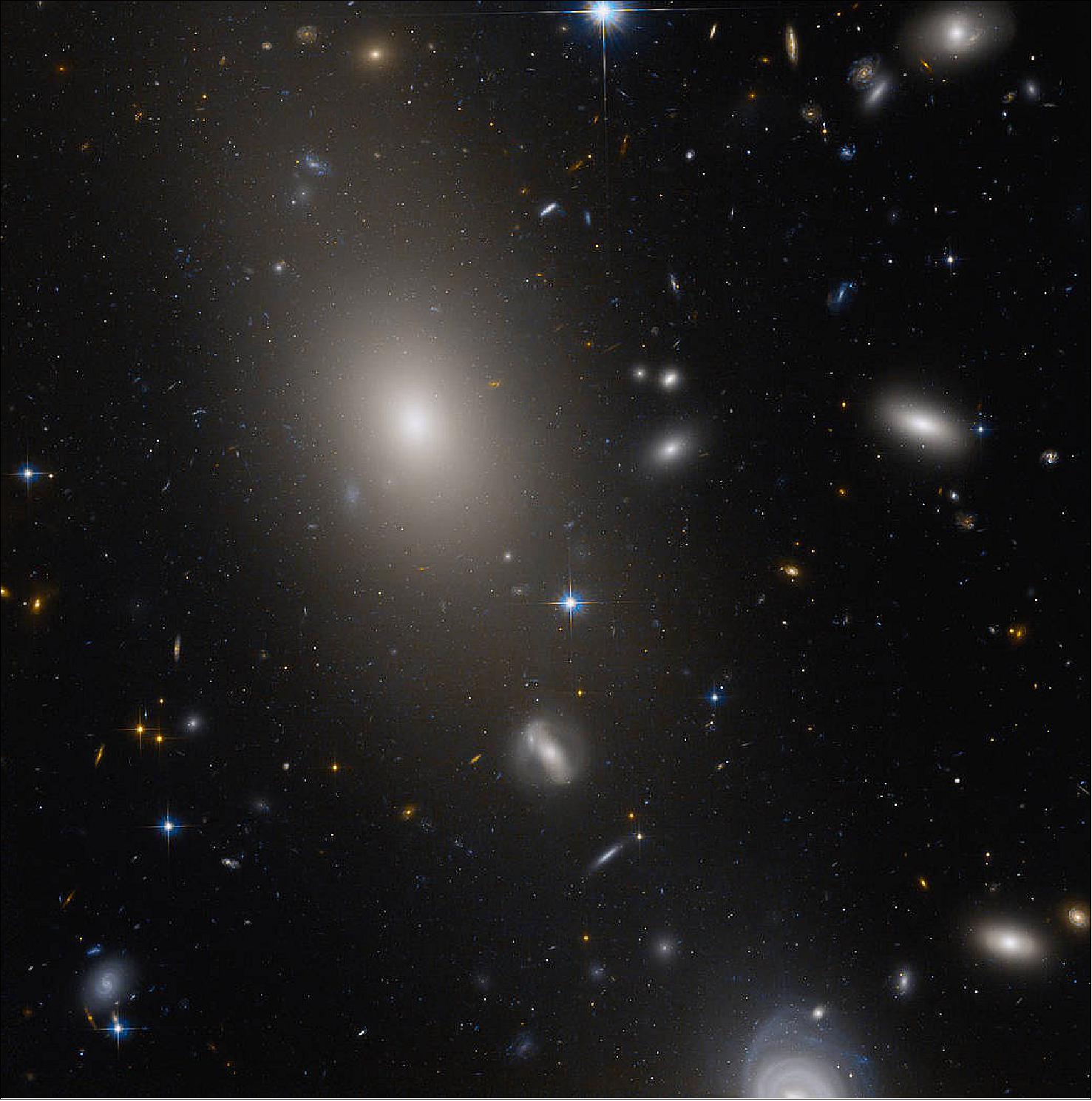 Figure 40: This image of UGC 10143 is part of a Hubble survey of globular star clusters associated with the brightest galaxies in galaxy clusters. Globular star clusters help astronomers trace the origin and evolution of their galactic neighbors. The Hubble survey looked at the distribution, brightness, and metal content of more than 35,000 globular star clusters. The image uses data from Hubble’s Advanced Camera for Surveys. Any gaps were filled by Hubble’s Wide Field and Planetary Camera 2 and the Pan-STARRS collaboration. The color blue represents visible blue light, and reddish-orange represents near infrared light.