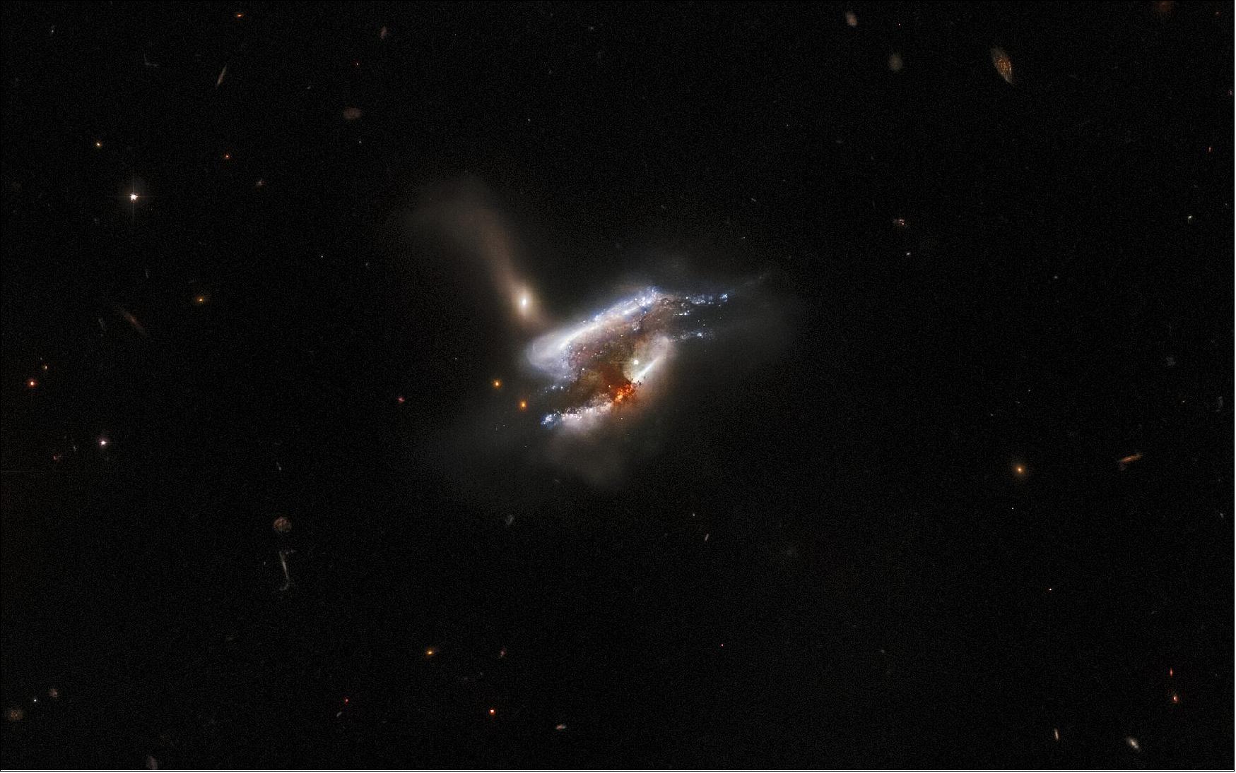 Figure 72: This image is from a series of Hubble observations investigating weird and wonderful galaxies found by the Galaxy Zoo citizen science project. Using Hubble’s powerful Advanced Camera for Surveys (ACS), astronomers took a closer look at some of the more unusual galaxies that volunteers had identified. The original Galaxy Zoo project was the largest galaxy census ever carried out, and relied on crowdsourcing time from more than 100,000 volunteers to classify 900,000 unexamined galaxies. The project achieved what would have been years of work for a professional astronomer in only 175 days, and has led to a steady stream of similar astronomical citizen science projects. Later Galaxy Zoo projects have included the largest ever studies of galaxy mergers and tidal dwarf galaxies, as well as the discovery of entirely new types of compact star-forming galaxies (image credit: ESA/Hubble & NASA, W. Keel, Dark Energy Survey, DOE, FNAL, DECam, CTIO, NOIRLab/NSF/AURA, SDSS; CC BY 4.0 Acknowledgement: J. Schmidt)