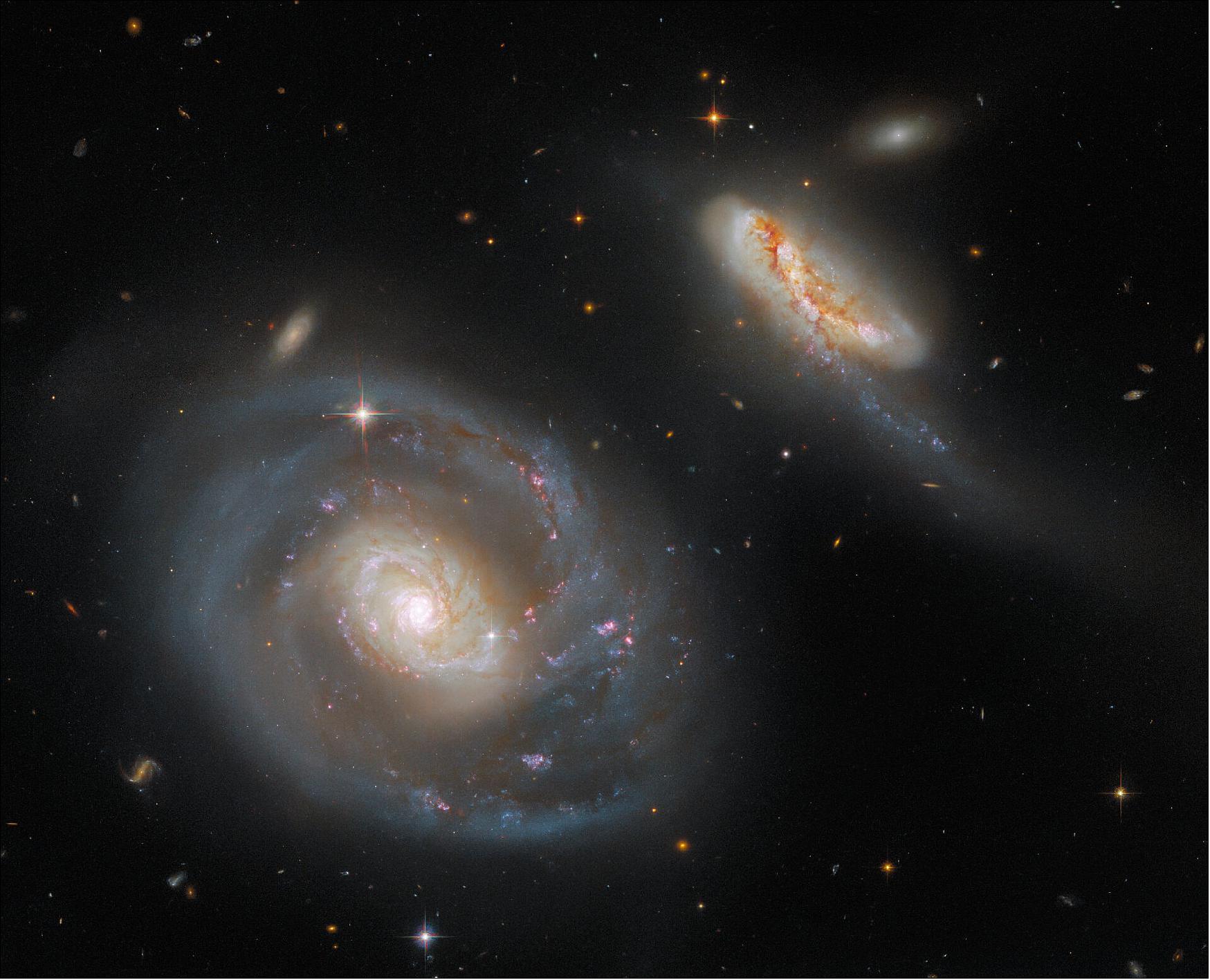 Figure 70: This image of Arp 298 contains data from three separate Hubble proposals. By combining observations from three proposals, Arp 298 is captured in glorious detail in seven different filters from two of Hubble’s instruments — the Wide Field Camera 3 and the Advanced Camera for Surveys (image credit: ESA/Hubble & NASA, A. Evans, R. Chandar; CC BY 4.0)