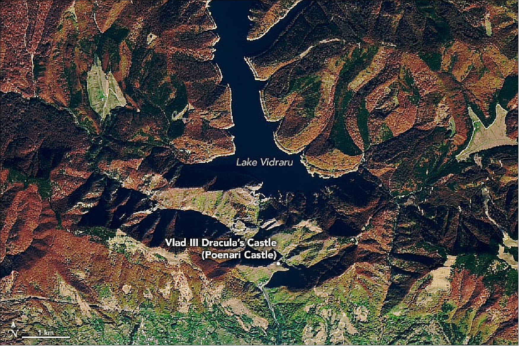 Figure 42: This natural colar image shows a more detailed view of the area around Poenari Castle and Lake Vidraru (a reservoir) as observed on October 24, 2019, by the Operational Land Imager (OLI) on the Landsat-8 satellite. Note the fall colors on the hillsides, as well as the foreboding shadows cast by the mountains. A drone flyover video gives an even closer perspective on the rugged landscape (image credit: NASA Earth Observatory, image by Joshua Stevens, using ICESat-2 data from the National Snow & Ice Center, topographic data from the SRTM, and Landsat data from the U.S. Geological Survey. Story by Mike Carlowicz)
