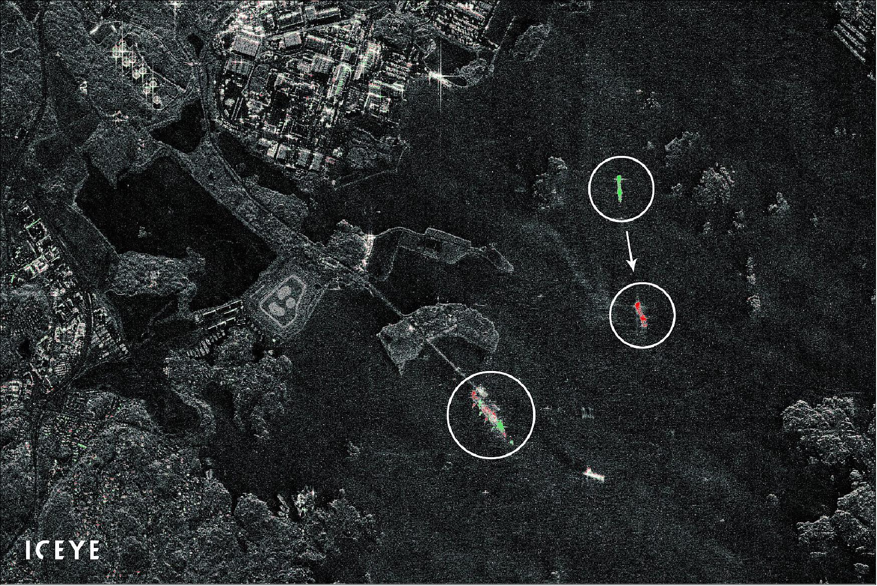 Figure 49: In this composite visualization, vessels in the port of Gothenburg, Sweden, are detected changing their position with just minutes between two combined SAR satellite images. Elements shown in green represent the position of elements only seen in the prior image, and elements in red represent elements only in the following image. One of the vessels is leaving the port, and another is slowly approaching the oil terminal visible in the scene (image credit: ICEYE)