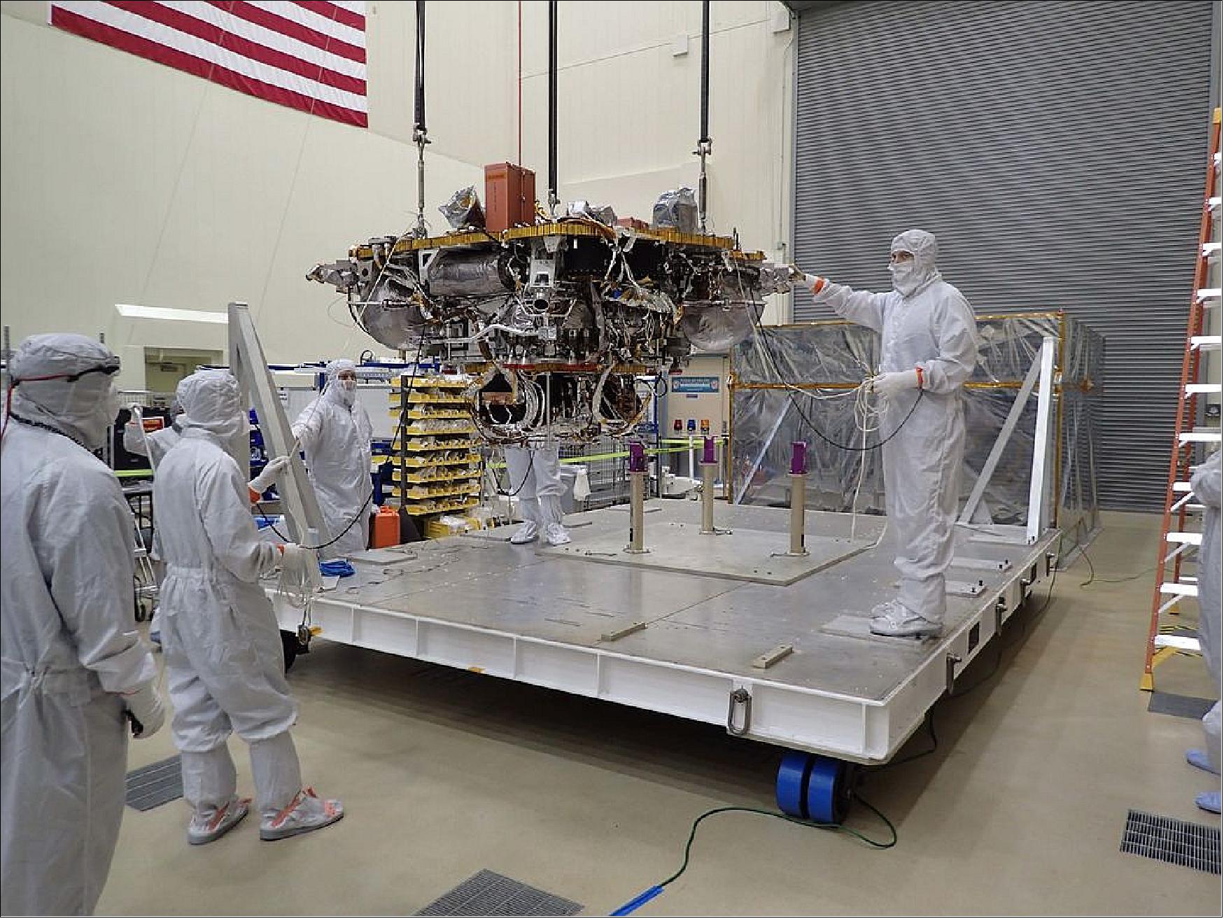 Figure 11: The Mars lander portion of NASA's InSight spacecraft is lifted from the base of a storage container in preparation for testing, in this photo taken June 20, 2017, in a Lockheed Martin clean room facility in Littleton, Colorado (image credit: NASA/JPL-Caltech, Lockheed Martin)