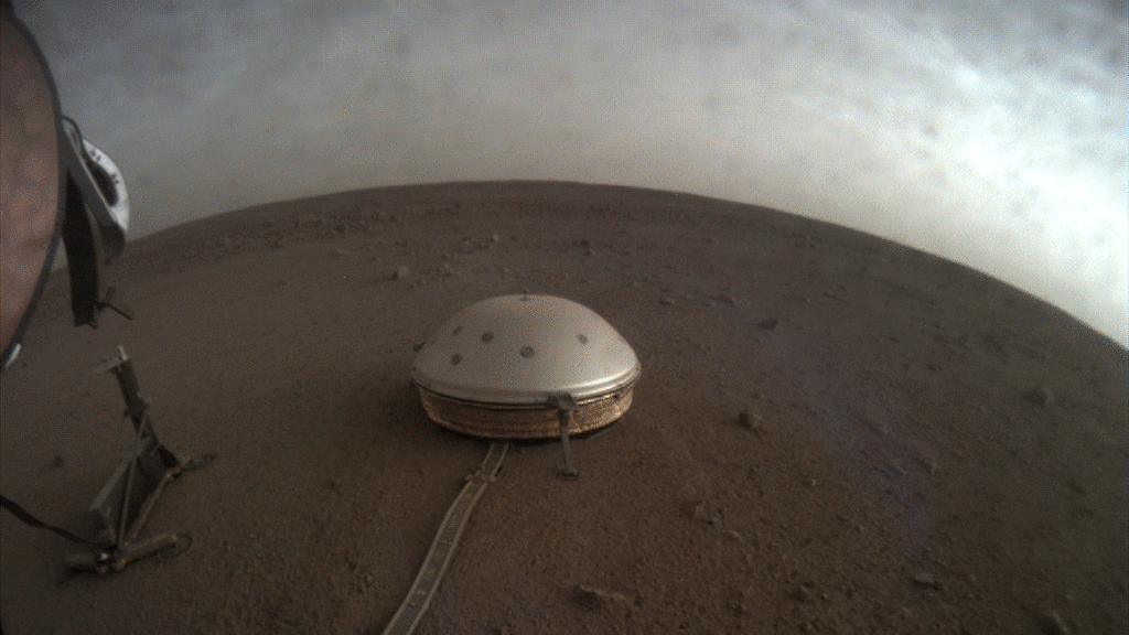 Figure 24: Clouds drift over the dome-covered seismometer, known as SEIS, belonging to NASA's InSight lander, on Mars (image credit: NASA/JPL-Caltech)
