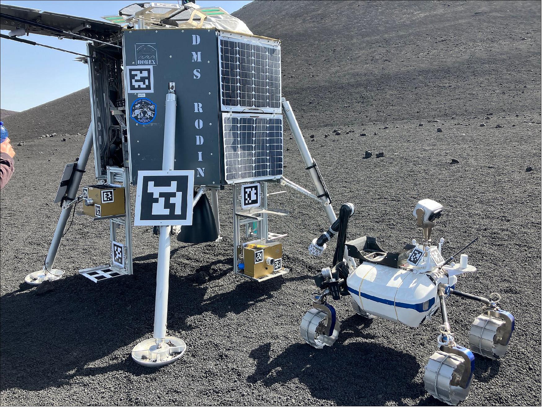 Figure 3: DLR's Lightweight Rover Unit-2 (LRU-2) delivering rock samples to the RODIN lunar lander during the ARCHES / Analog-1 test campaign on Mount Etna (image credit: ESA)