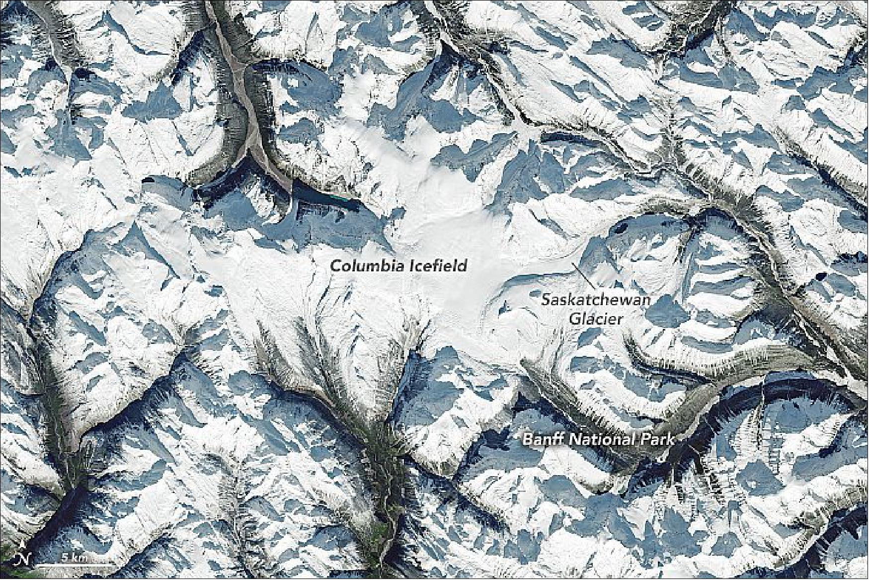 Figure 26: The icefield is visible in this image, acquired on October 31, 2021, by the Operational Land Imager (OLI) on Landsat 8. The icefield spans the provinces of British Columbia and Alberta, as well as Jasper and Banff National Parks. Saskatchewan Glacier, the icefield’s largest outlet glacier, forms the headwaters of the North Saskatchewan River—an important source of freshwater for communities downstream. Clear skies between storm systems gave satellites a cloud-free view from the Coast Mountains in British Columbia to the Rockies in western Alberta (image credit: NASA Earth Observatory using Landsat data from the U.S. Geological Survey )