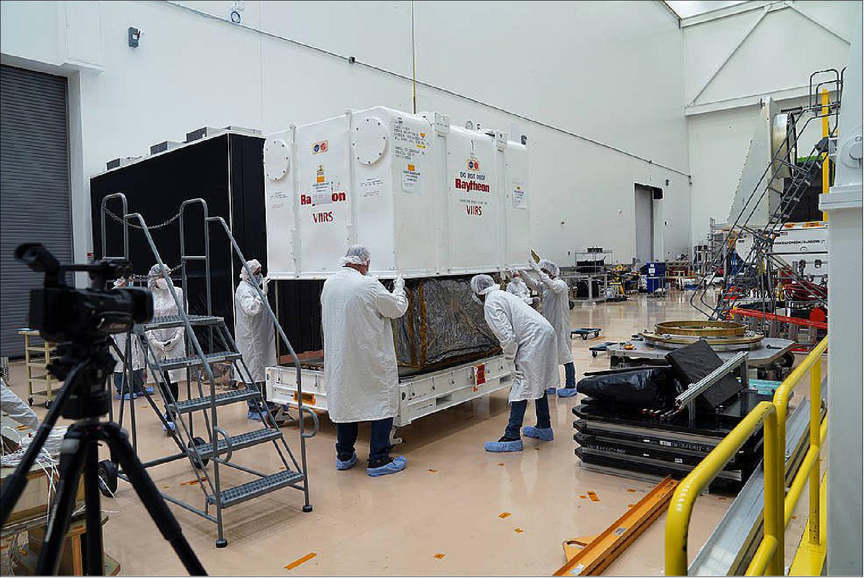 Figure 8: Engineers unpack the VIIRS instrument from its protective shipping container at Northrop Grumman’s spacecraft facility in Gilbert, Arizona (image credit: Northrop Grumman)
