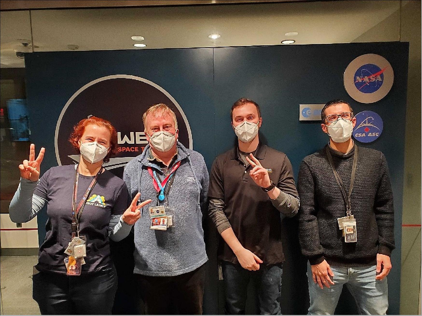 Figure 37: "The picture here shows tired and happy MIRI team members at the Mission Operations Center in Baltimore, after completing this first of the many MIRI commissioning steps. The MIRI Contamination Control Cover will be closed in the next few days to protect the optics from any possible contaminants as the observatory cools. It will then be reopened much later in the timeline, when MIRI has cooled to its operating temperature of just 7K and is ready to look out at the sky."(Gillian Wright, European principal investigator for the Mid-Infrared Instrument, UK Astronomy Technology Centre)