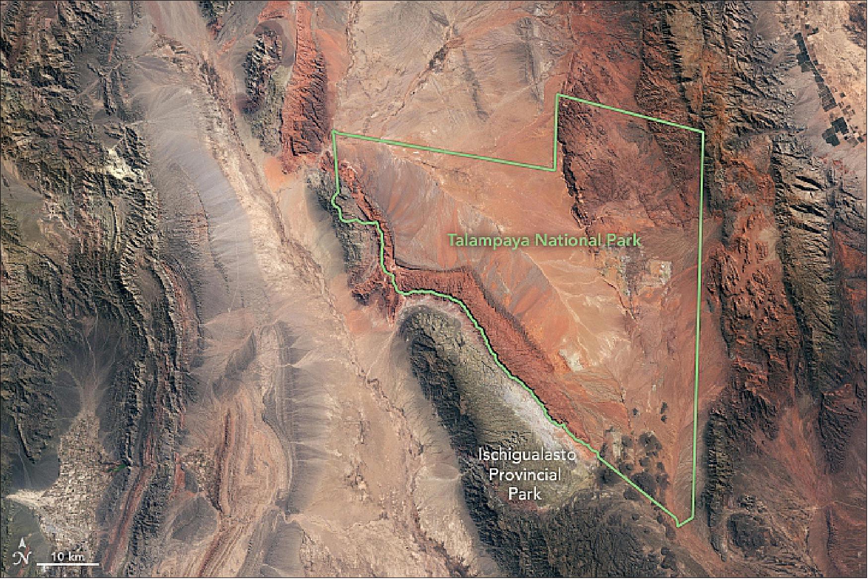 Figure 115: This image shows two notable dinosaur habitats, the Talampaya and Ischigualasto Natural Parks, located near the Argentina-Chile border. This image was acquired by the OLI (Operational Land Imager) by Landsat-8 on August 25, 2018. Together, the parks cover more than 275,000 hectares (2750 km2), image credit: NASA Earth Observatory, image by Lauren Dauphin, using Landsat data from the U.S. Geological Survey. Story by Kasha Patel.