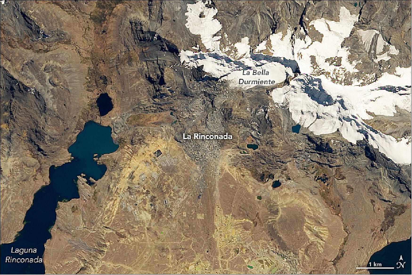Figure 17: This natural-color image was acquired on August 1, 2019, by the Operational Land Imager on Landsat-8. La Rinconada lies in southeastern Peru, near Lake Titicaca and close to the Bolivian border. The town is located on the side of Mount Ananea and below a giant glacier called La Bella Durmiente, meaning “Sleeping Beauty” (image credit: NASA Earth Observatory, image by Lauren Dauphin, using Landsat data from the U.S. Geological Survey. Story by Kasha Patel)