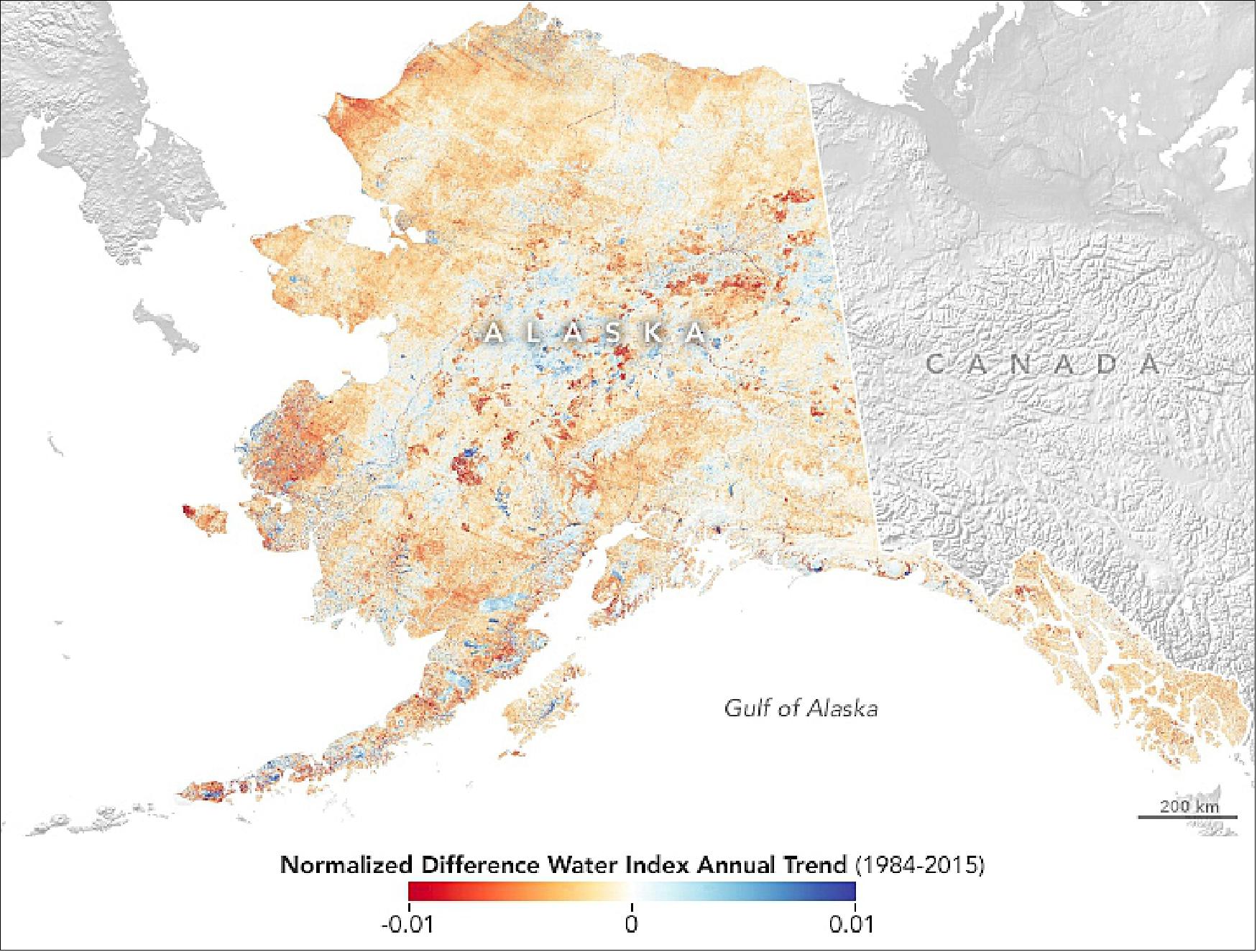Figure 112: Pastick and colleagues used satellite and aerial photograph comparisons to verify the type of ecological change responsible for broader trends in the landscape. For example, this map shows the median change in the landscape’s wetness per year between 1 January 1984 and 31 December 2015. Analyzing all of the information together led them to conclude that 174,000 square miles (451,000 km2) of the Alaskan landscape has undergone change (image credit: NASA Earth Observatory image by Lauren Dauphin, using Landsat data from the U.S. Geological Survey and NDVI and NDWI annual trend data courtesy of Neal Pastick. Story by Kathryn Hansen)