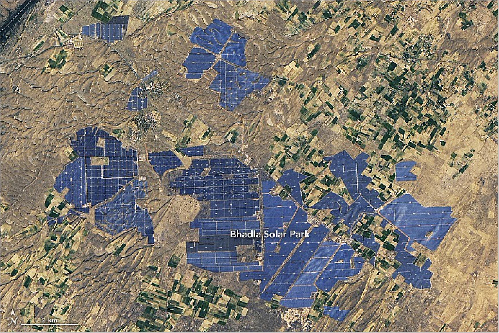 Figure 72: Construction of the Bhadla Solar Park, near India’s border with Pakistan, began to appear in satellite imagery in 2015. Now millions of solar photovoltaic panels blanket Phalodi, giving a metallic look to landscapes that were once sandy and brown. The Operational Land Imager (OLI) on Landsat 8 captured this natural-color satellite image of the park on January 26, 2022 (image credit: ASA Earth Observatory image by Lauren Dauphin, using Landsat data from the U.S. Geological Survey. Story by Adam Voiland)