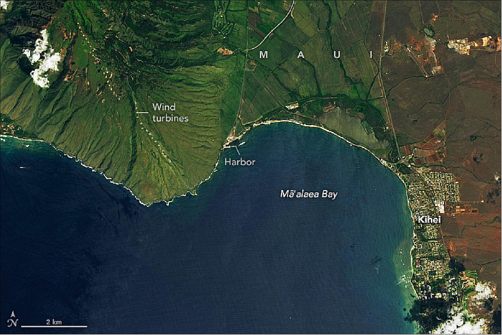 Figure 44: When large waves break in Mā`alaea Bay, they do so with the crushing speed of a freight train. The foam produced by breaking waves shows up in satellite images as a white band close to the shore. In the image above, acquired on October 3, 2018, with the Operational Land Imager (OLI) on Landsat-8, a small amount of foam is visible near the harbor. The late season waves were probably influenced by Hurricane Walaka, a category-4 storm centered about 750 miles (1,200 km) west of Mā`alaea (image credit: NASA Earth Observatory images by Lauren Dauphin, using Landsat data from the U.S. Geological Survey. Story by Kathryn Hansen)