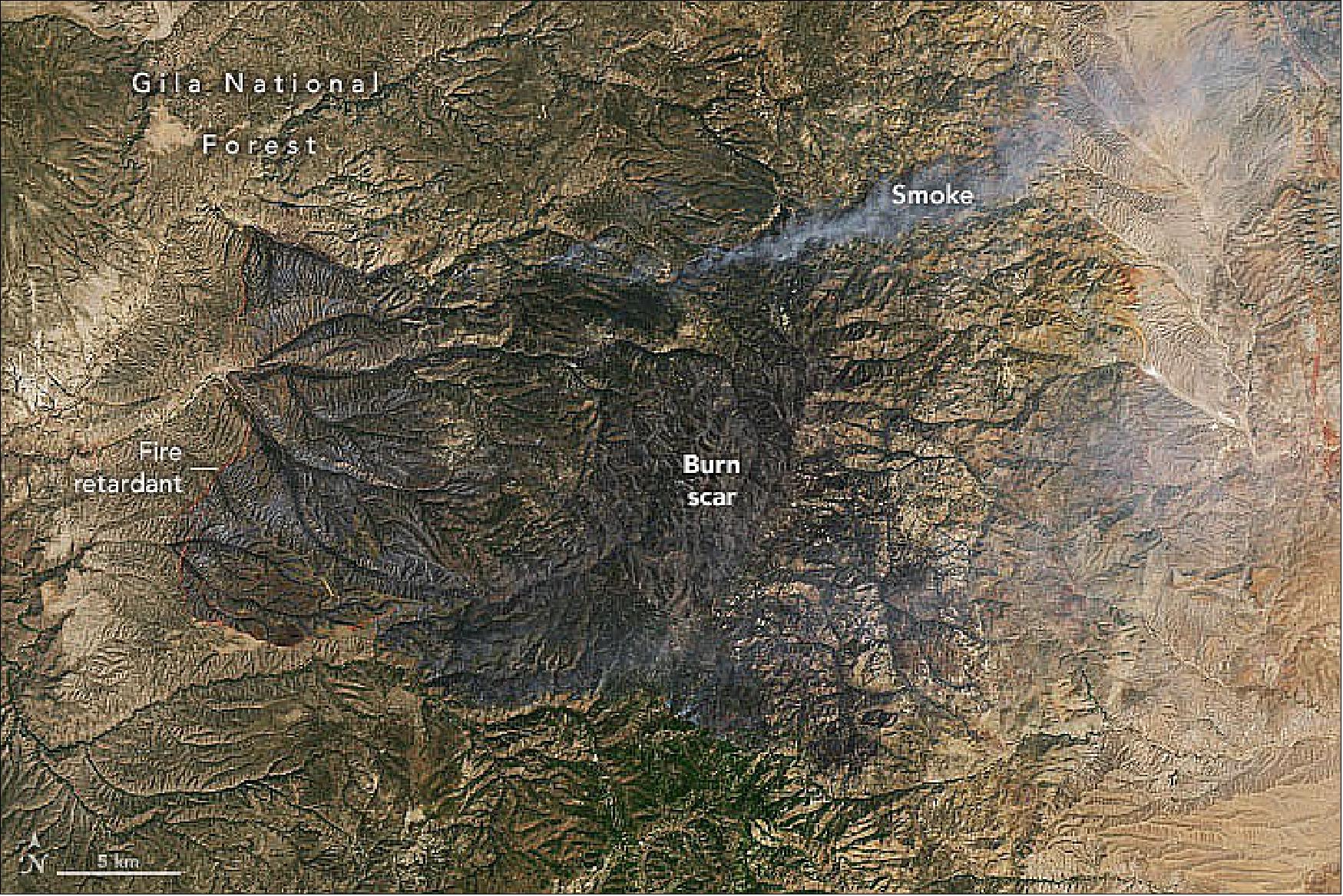 Figure 42: These images, acquired on May 21, 2022, by the OLI instrument on Landsat-8, show the area burned by the Black fire in both natural and false color (Figure 43). The false-color image combines shortwave infrared, near infrared, and visible light (OLI bands 7-5-2). Near and shortwave infrared help penetrate clouds and smoke (gray-white) to reveal the hotspots associated with active fires (red). With this combination, burned areas appear reddish-brown (image credit: NASA Earth Observatory images by Lauren Dauphin, using Landsat data from the U.S. Geological Survey. Story by Sara E. Pratt)