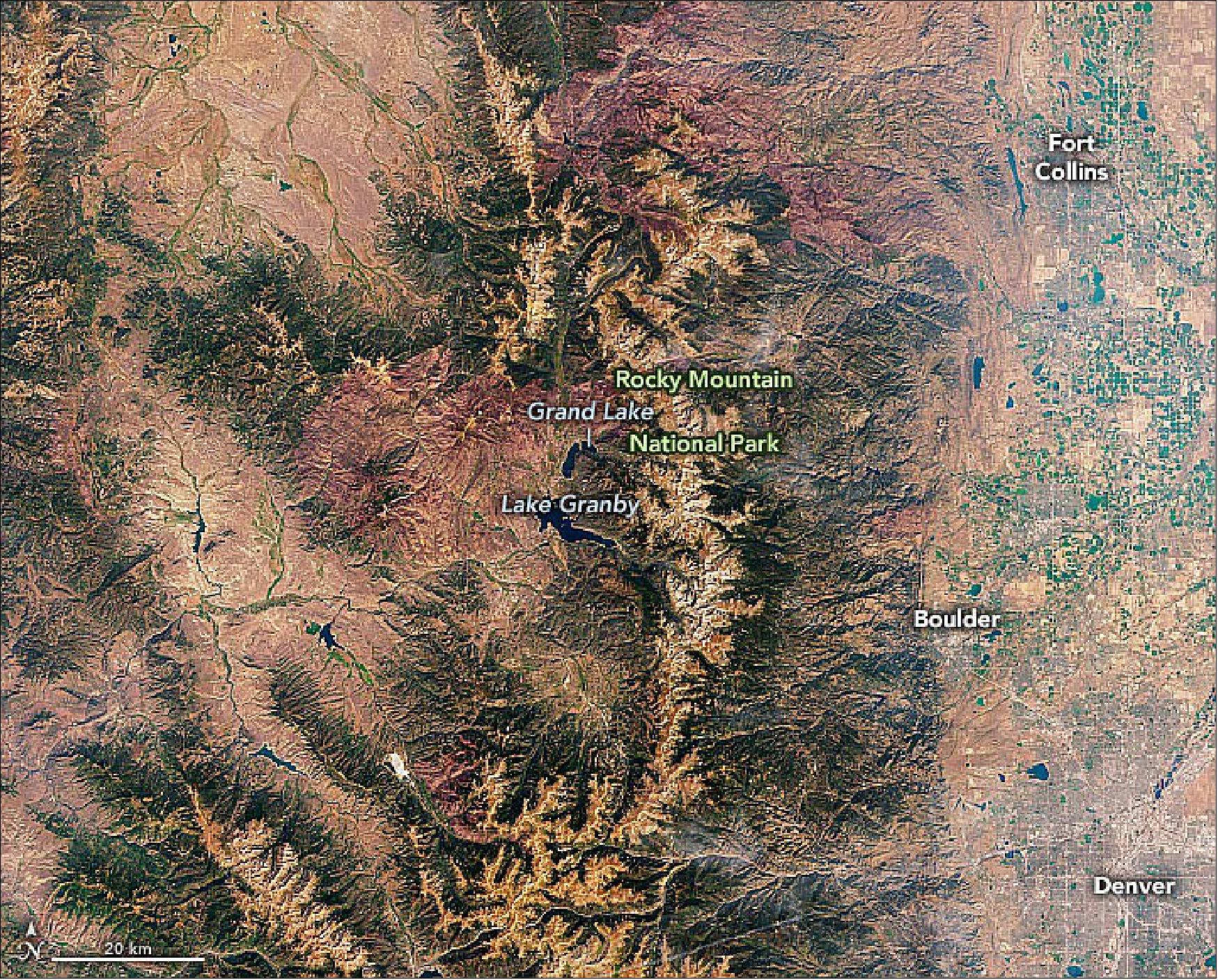 Figure 32: Landsat-8 image of the continental divide in Colorado. Snowmelt and runoff collected in Lake Granby is pumped to a canal that flows into Shadow Mountain Reservoir and Grand Lake, where it enters the West Portal of the Adams tunnel. Upon exiting the East Portal, the water flows into the Wind River toward Mary’s Lake, then proceeds through other tunnels and canals to multiple Front Range reservoirs. Between the West and East portals, the tunnel’s elevation drops 109 feet (33 meters). Driven by the force of gravity, water flows through the tunnel at a rate of 550 cubic feet (15.5 m3/s) — traveling the length of the tunnel in about two hours (image credit: NASA Earth Observatory)