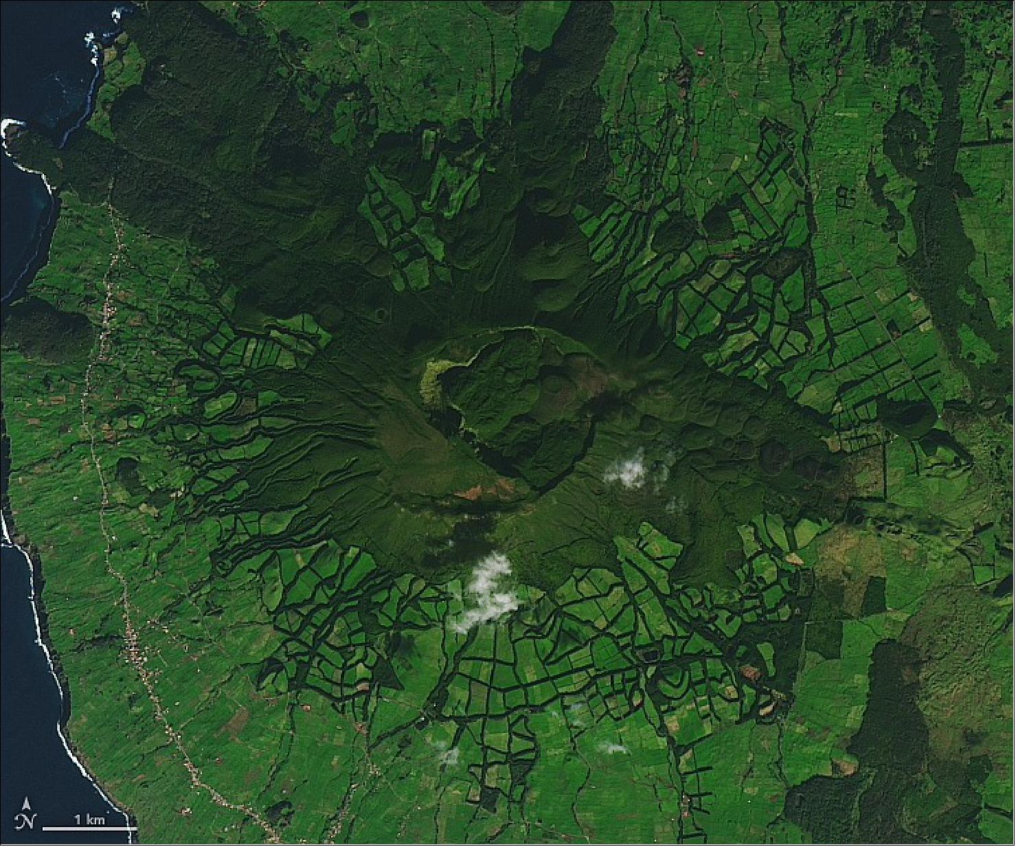Figure 28: This detailed view shows the volcanic features of Serra de Santa Bárbara. The peak includes a double caldera, which formed from summit collapses 25,000 and 15,000 years ago. Also visible are small lava domes that formed on the eastern flank in 1761 during the last volcanic eruption to occur on land on Terceira (image credit: NASA Earth Observatory)